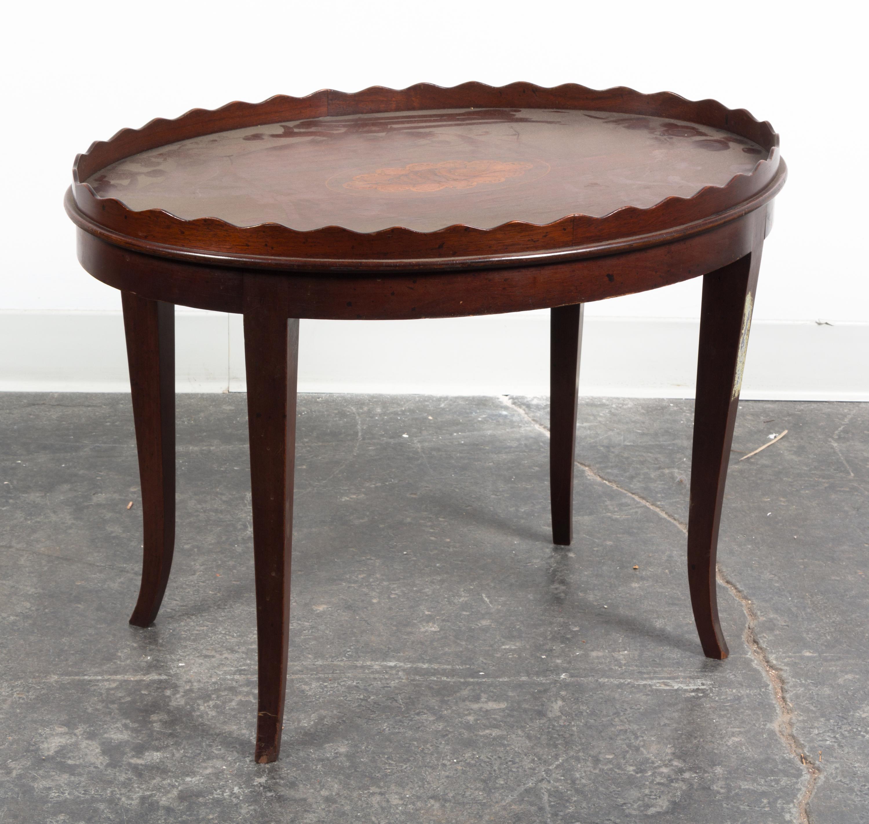 An Oval Low Table Height 19 3/4 x width 26 3/4 x depth 19 1/4 inches.