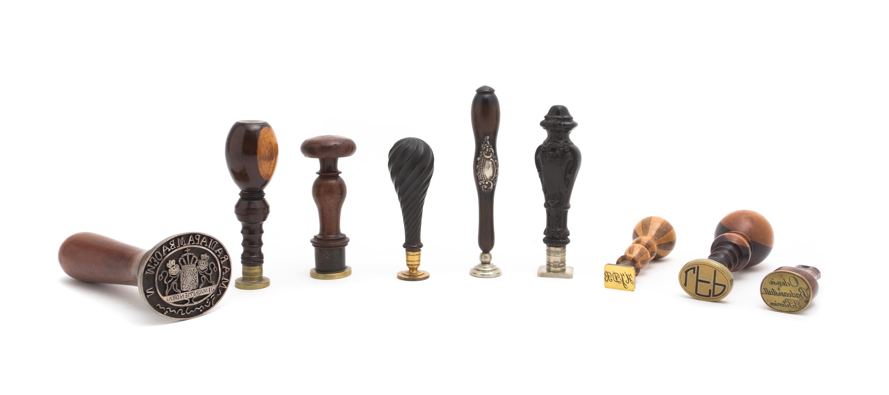 A Collection of Turned and Carved Wood Seals, Height of tallest 4 3/4 inches.