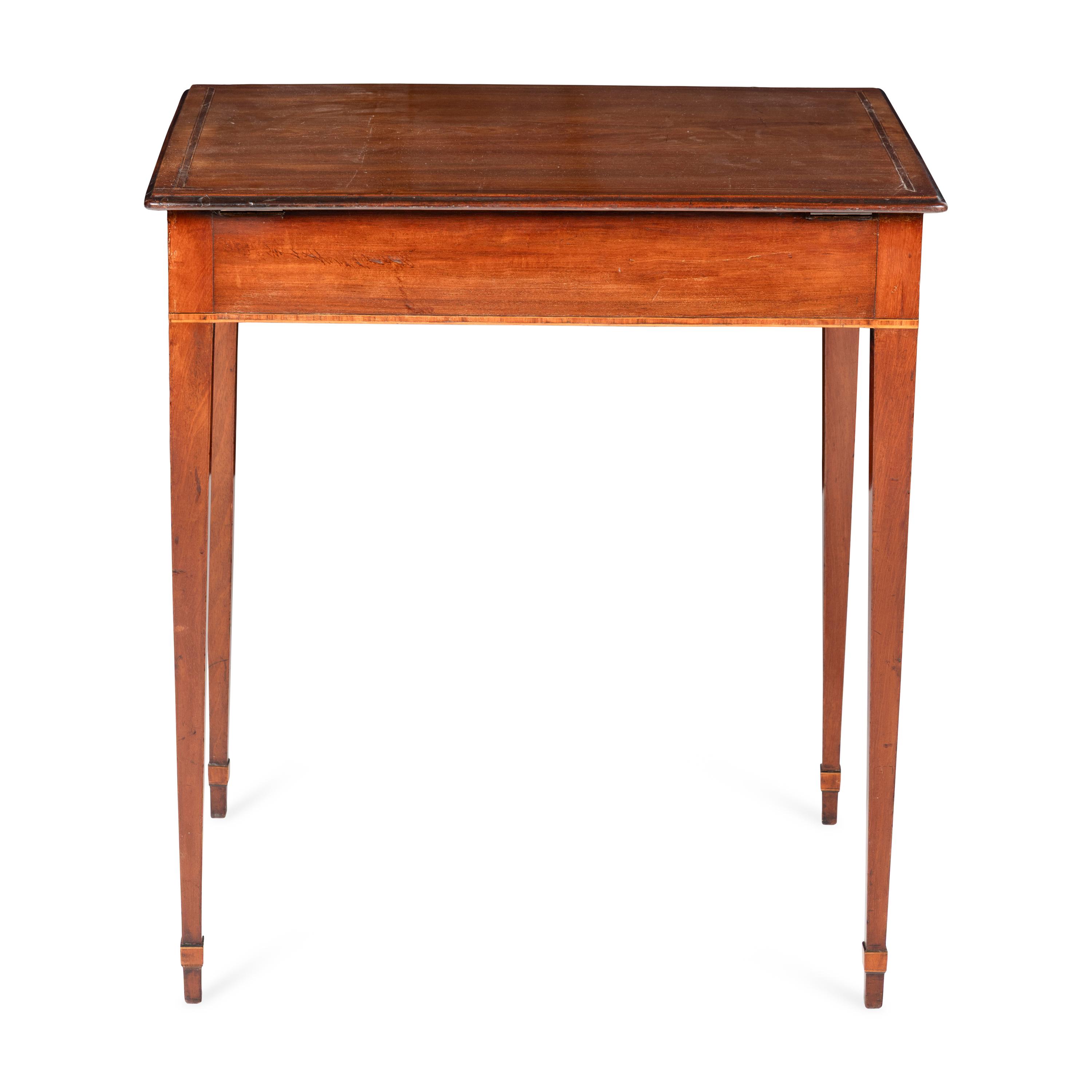 A George III Mahogany Lift-Top Writing Table