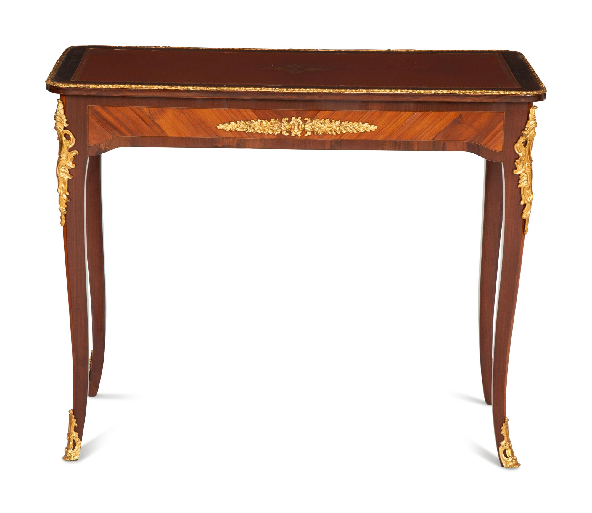 A Louis XV Style Gilt Bronze Mounted Kingwood and Mahogany Writing Table