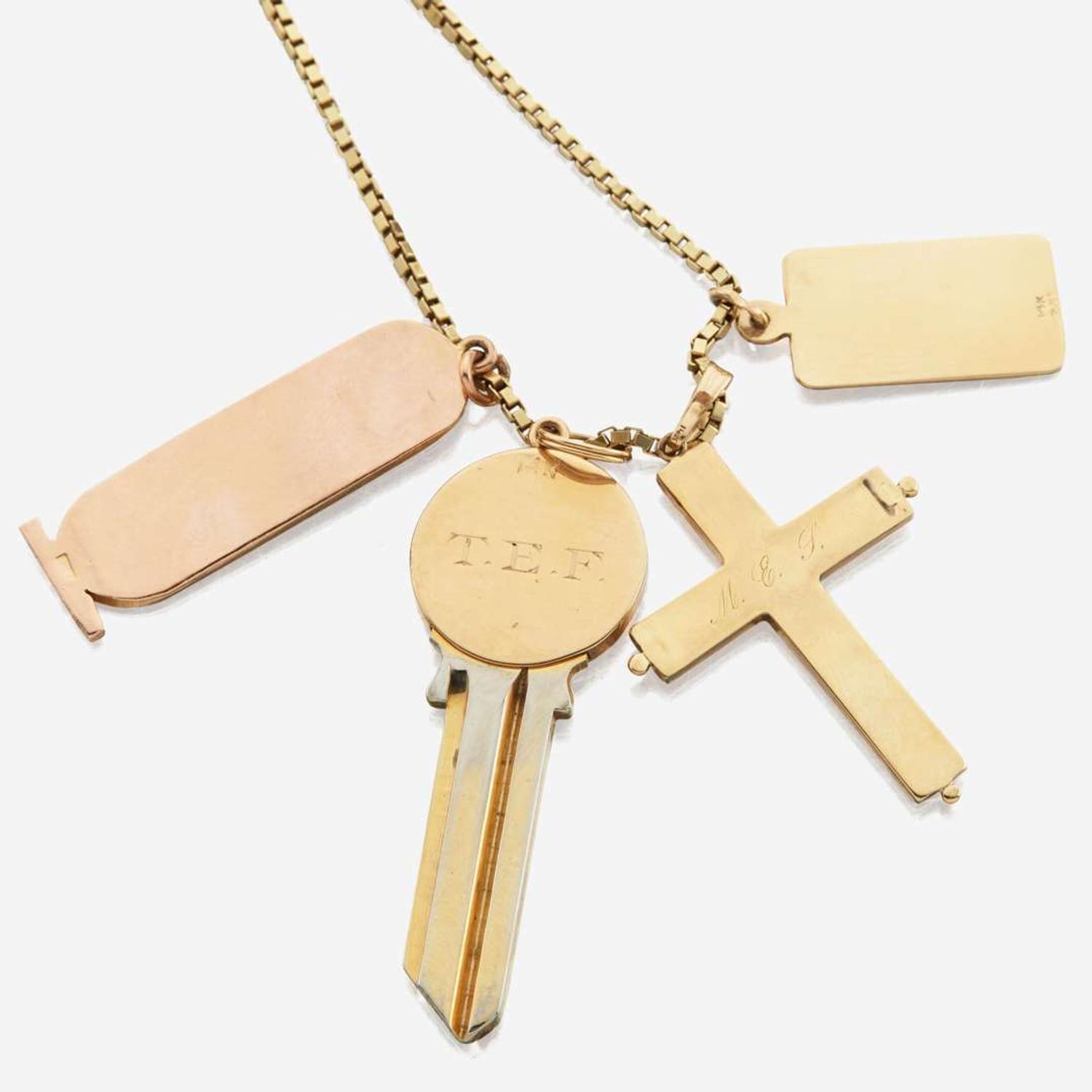 A collection of four gold necklaces