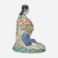 A Chinese enameled Dehua porcelain figure of Guanyin seated 18th Century, later decorated