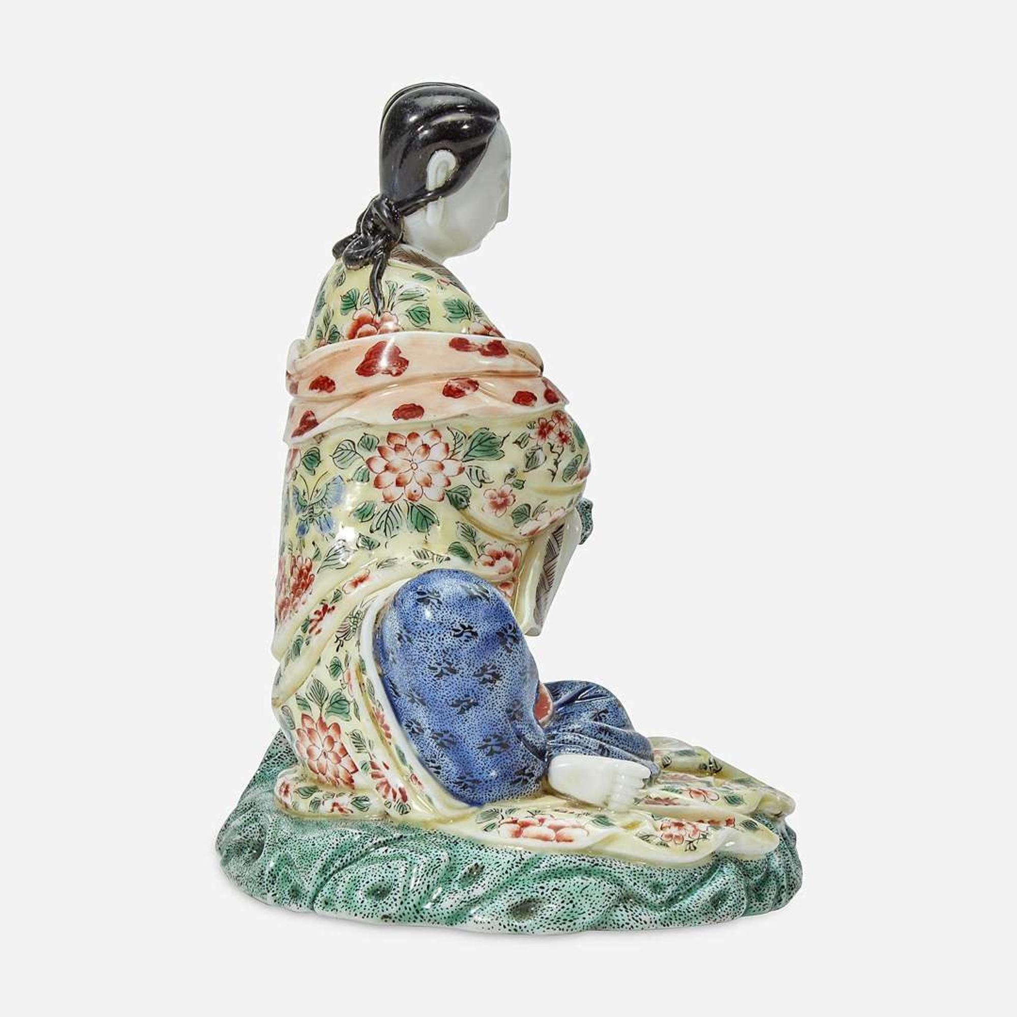 A Chinese enameled Dehua porcelain figure of Guanyin seated 18th Century, later decorated
