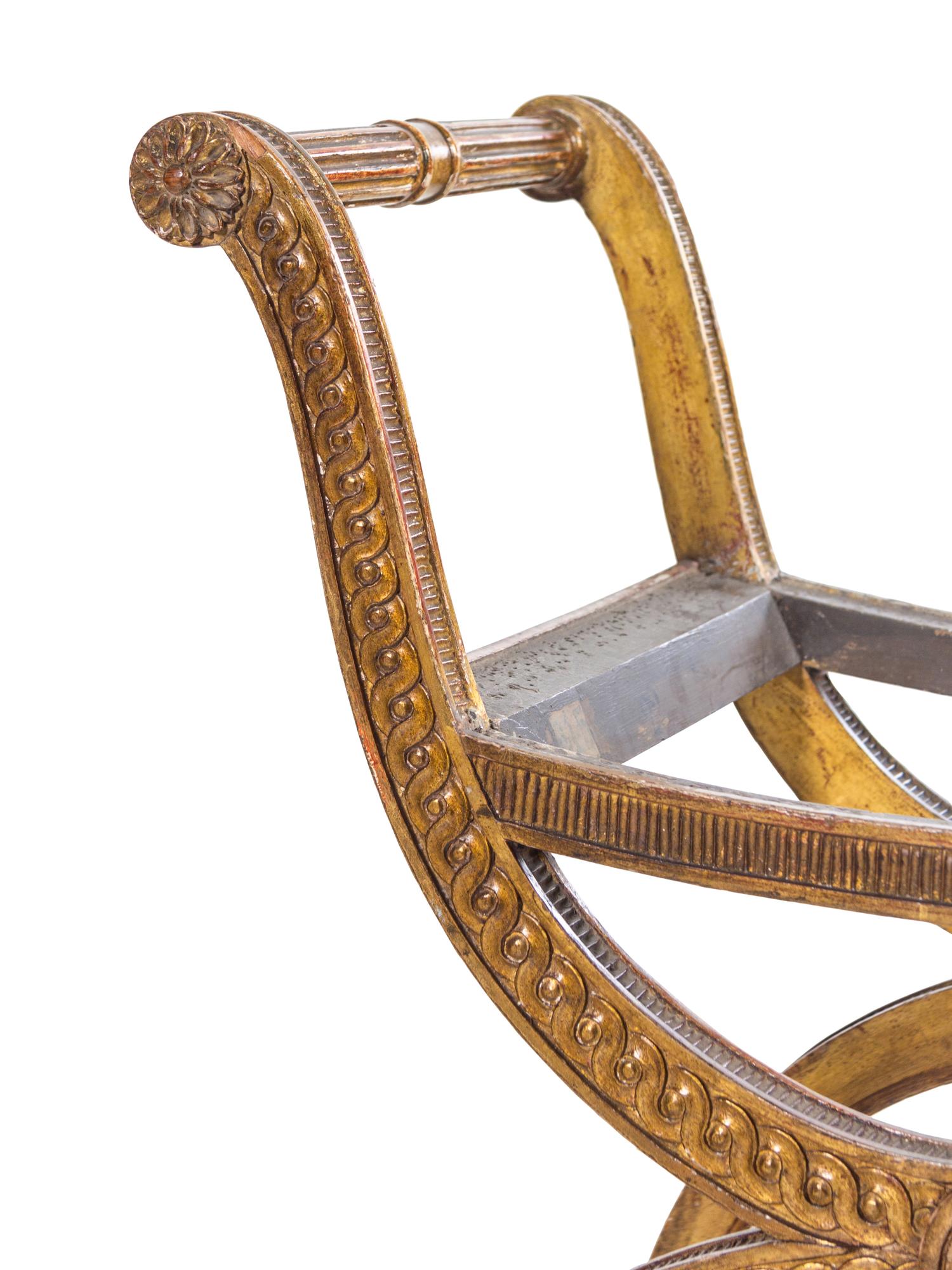 A Louis XVI Style Carved Giltwood Curule Bench