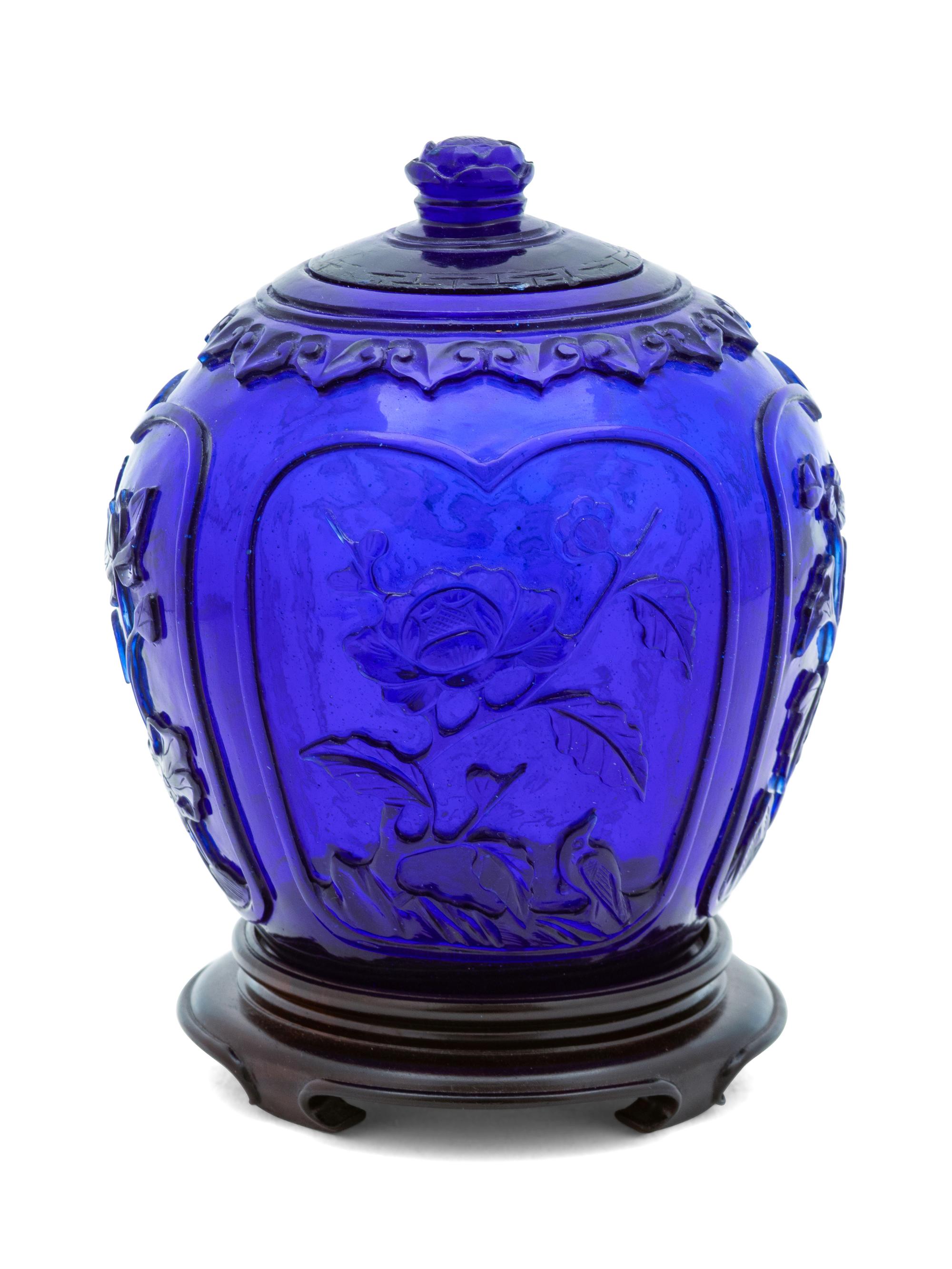 A Chinese Carved Transparent Blue Ovoid Jar and Cover