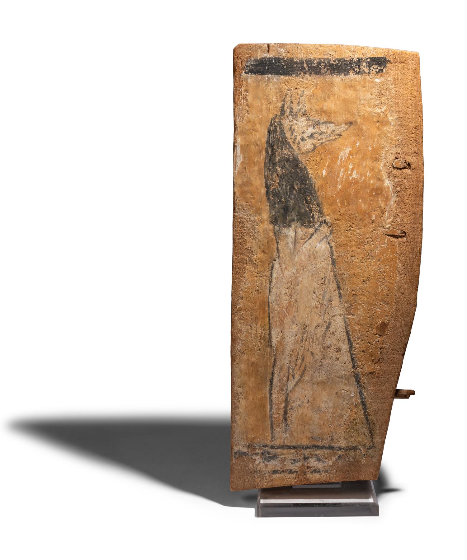 An Egyptian Painted Wood Sarcophagus Fragment with Anubis