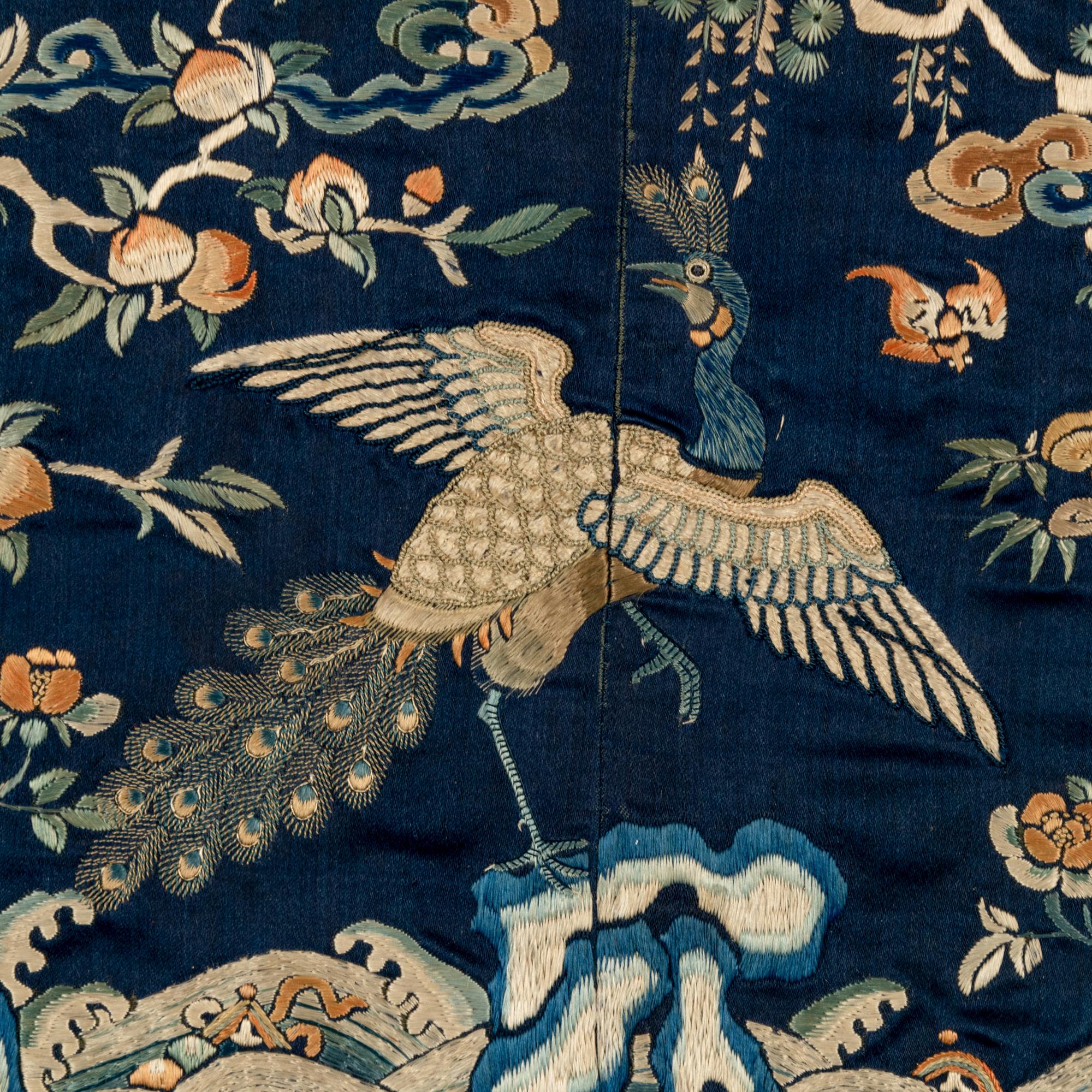 A Chinese Embroidered Silk 'Peacock' Rank Badge, Qianlong Period 清乾隆 石青緞地綉三品文官孔雀補子