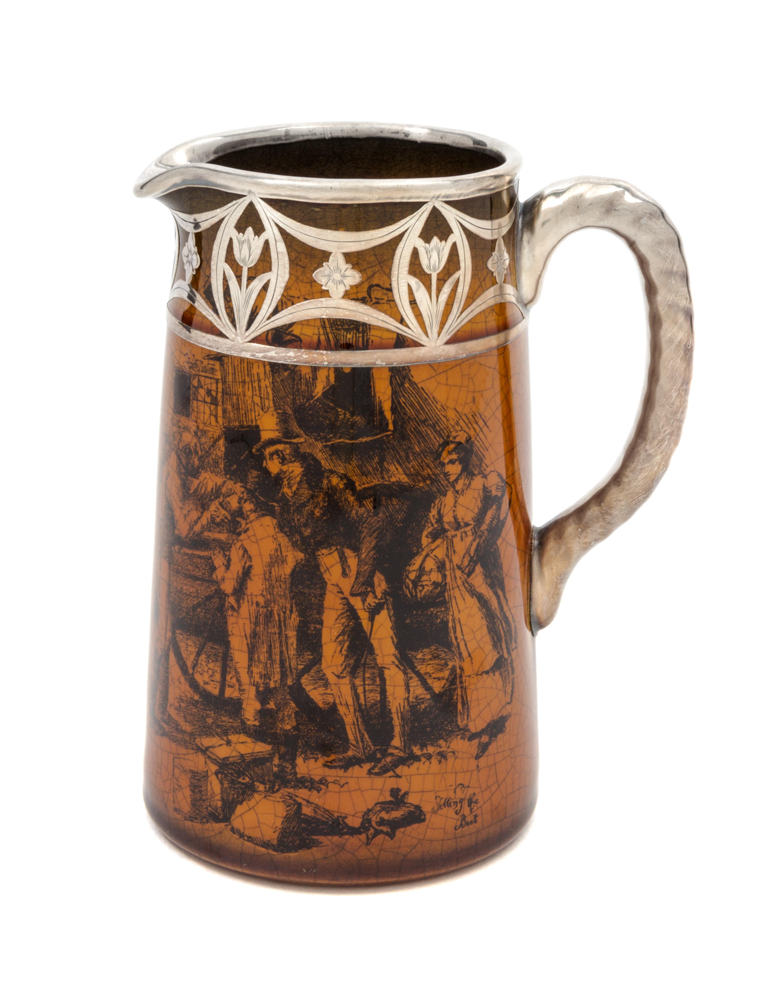 A Silver Overlay Transfer Decorated Ceramic Pitcher Height 6 1/4 inches.