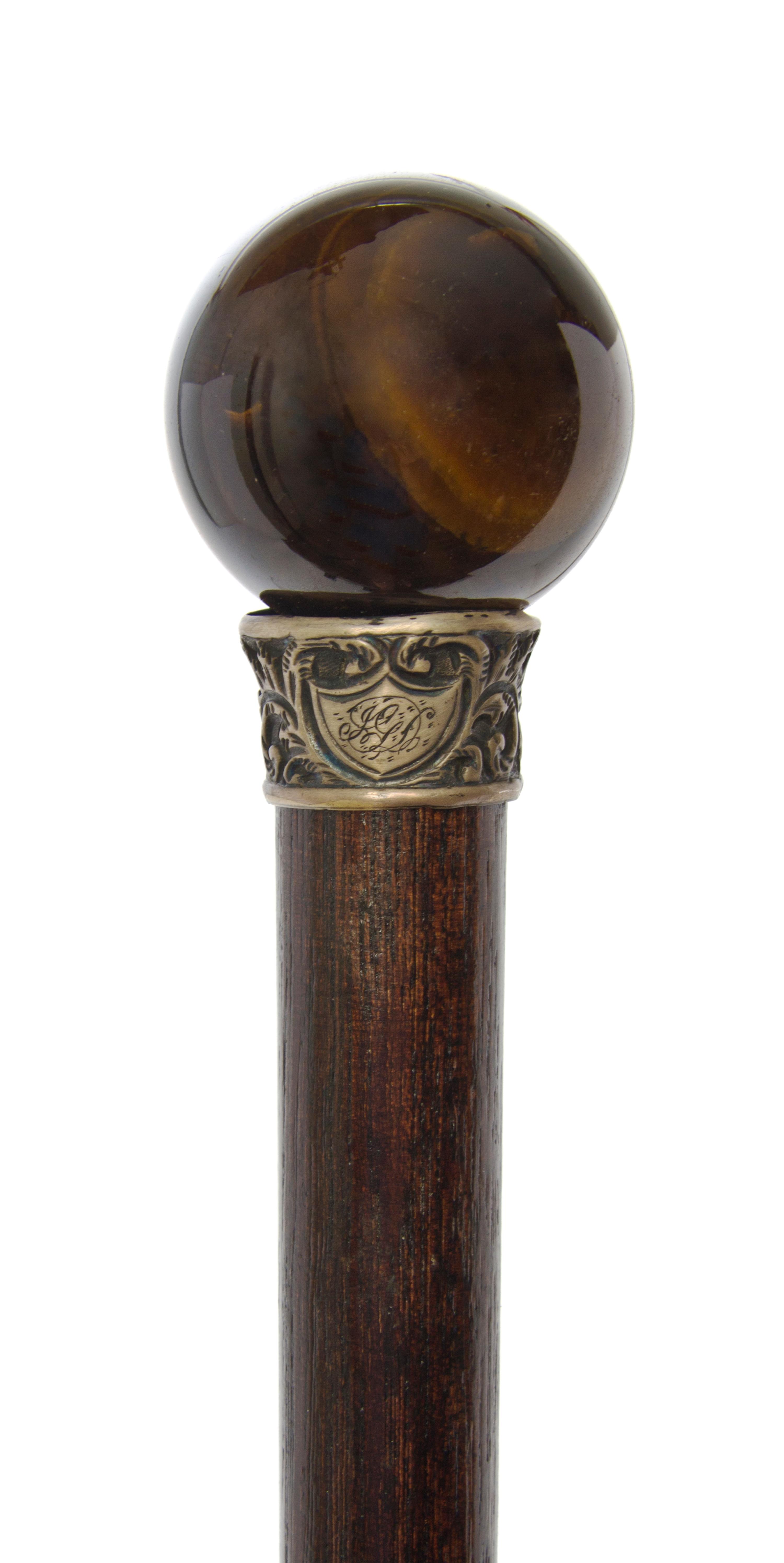 An American Handled Walking Stick, Diameter of handle 1 1/2 x length overall 34 5/8 inches.
