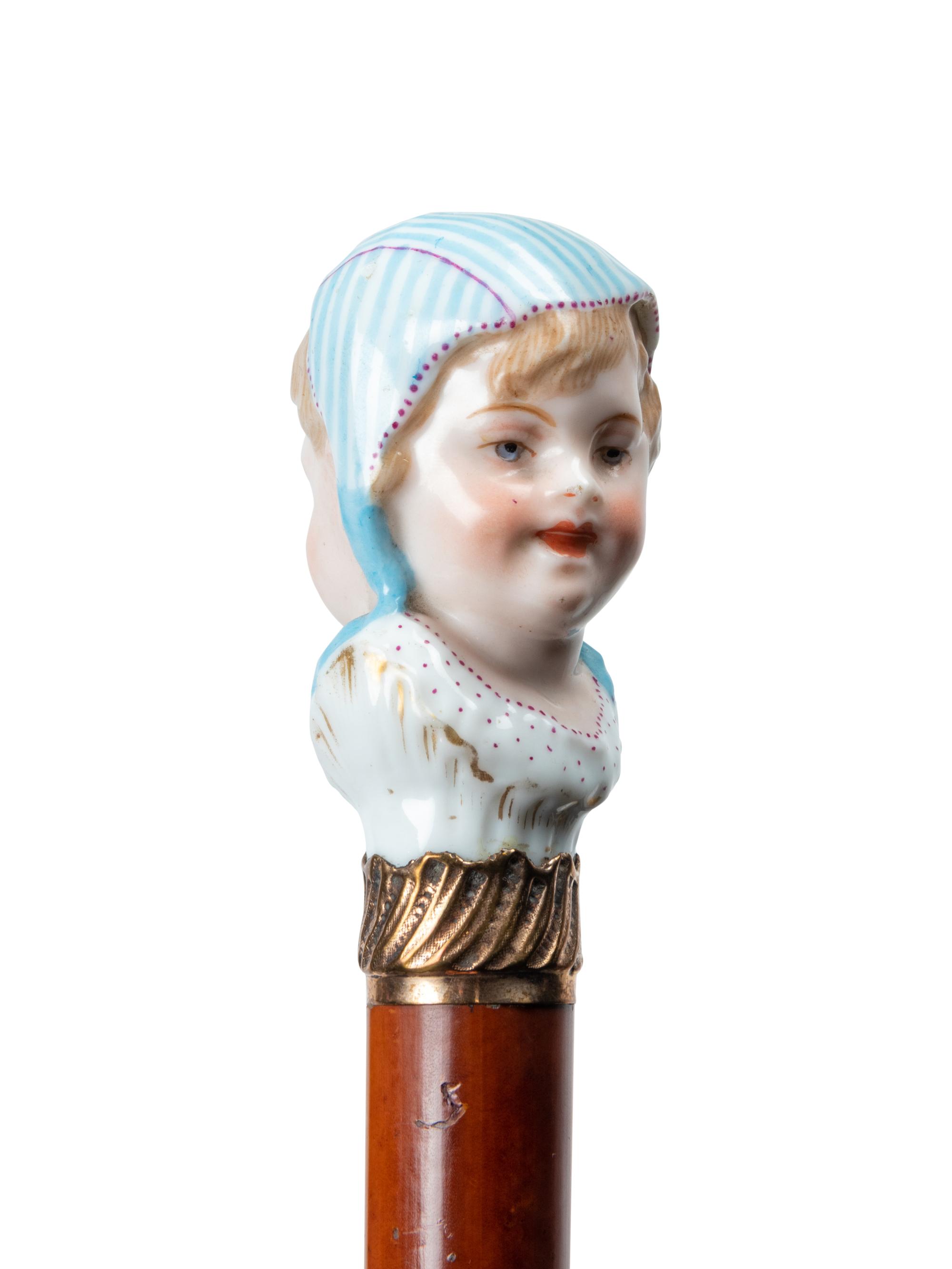 A French Figural Porcelain and Gilt Metal Mounted Cane