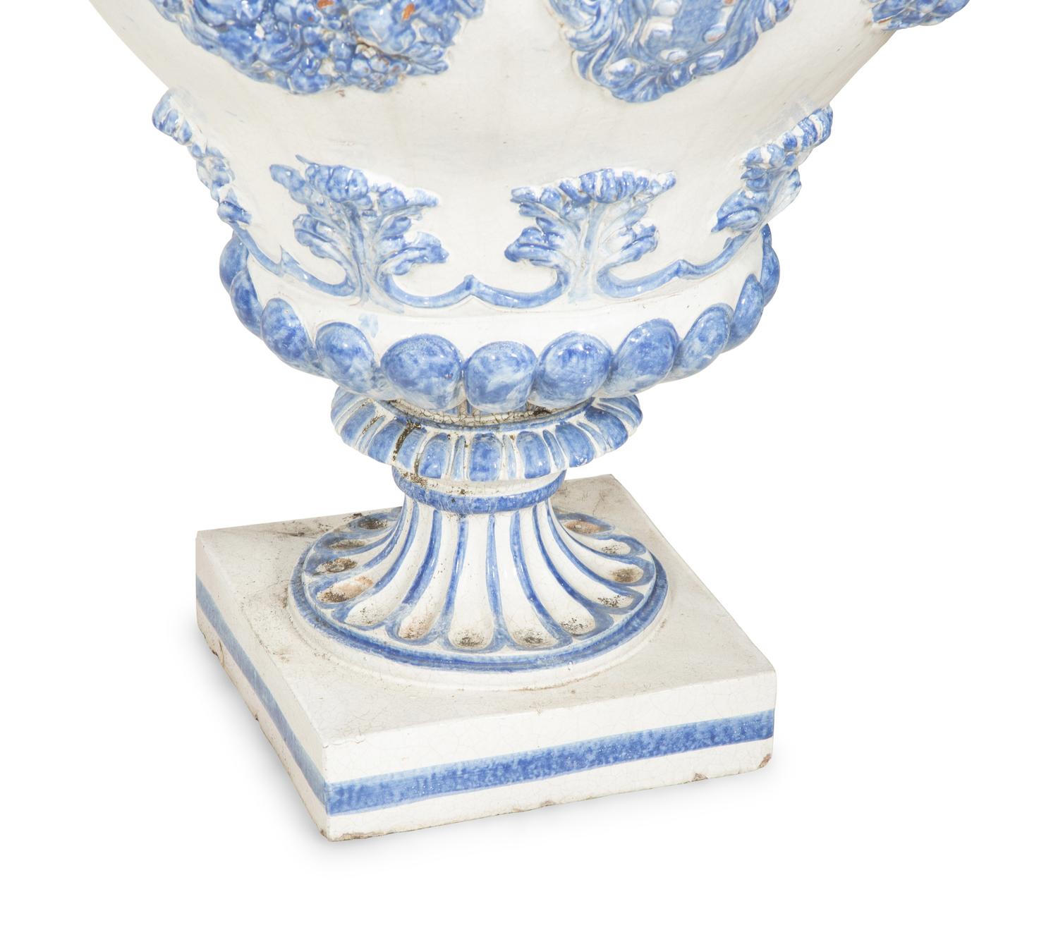A Pair of Italian Blue and White Glazed Ceramic Covered Urns