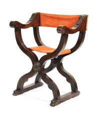 An Italian Walnut Savonarola Chair Height 26 1/4 x width 19 x depth 34 inches.