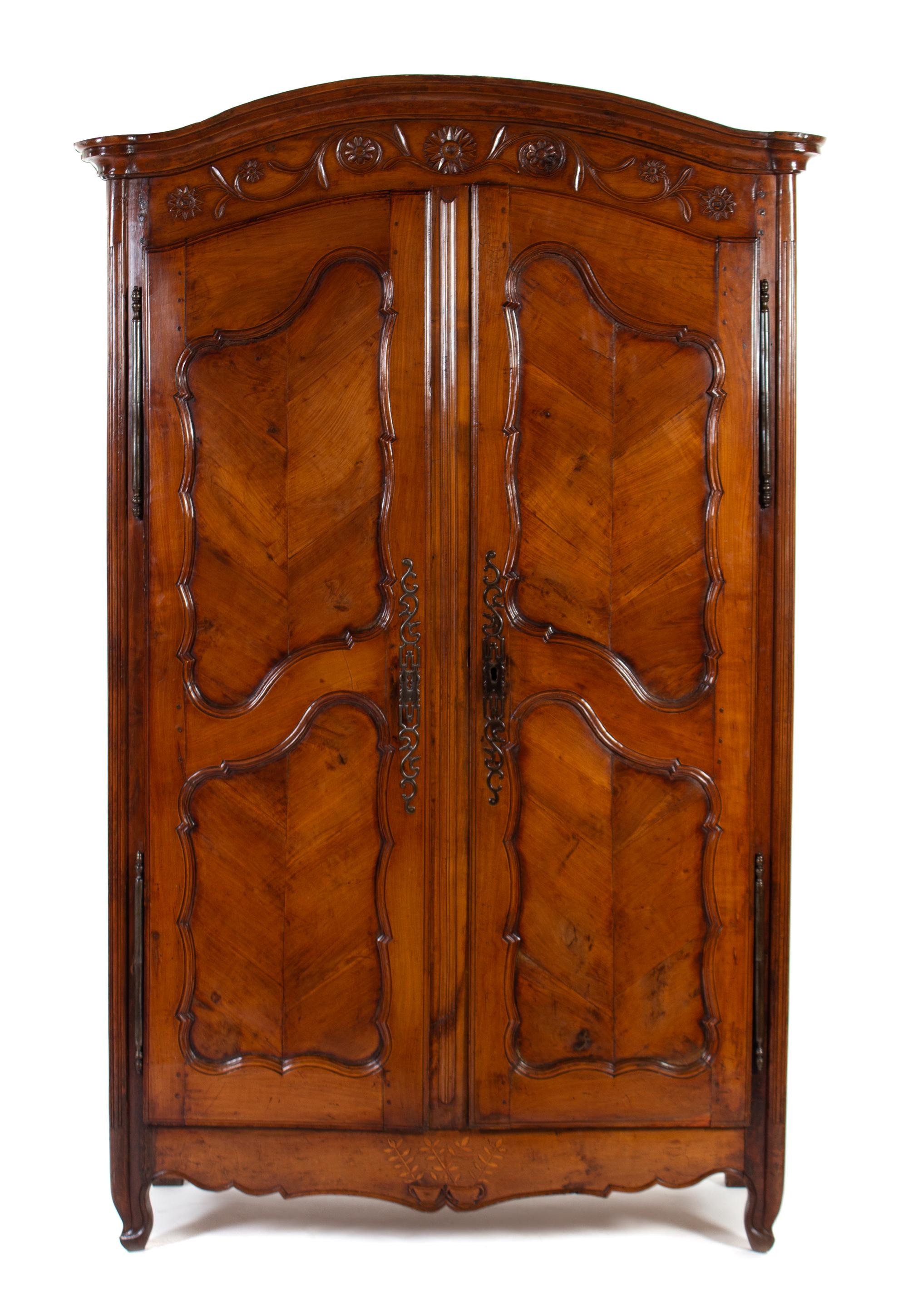 A Louis XV Style Inlaid and Carved Walnut Armoire