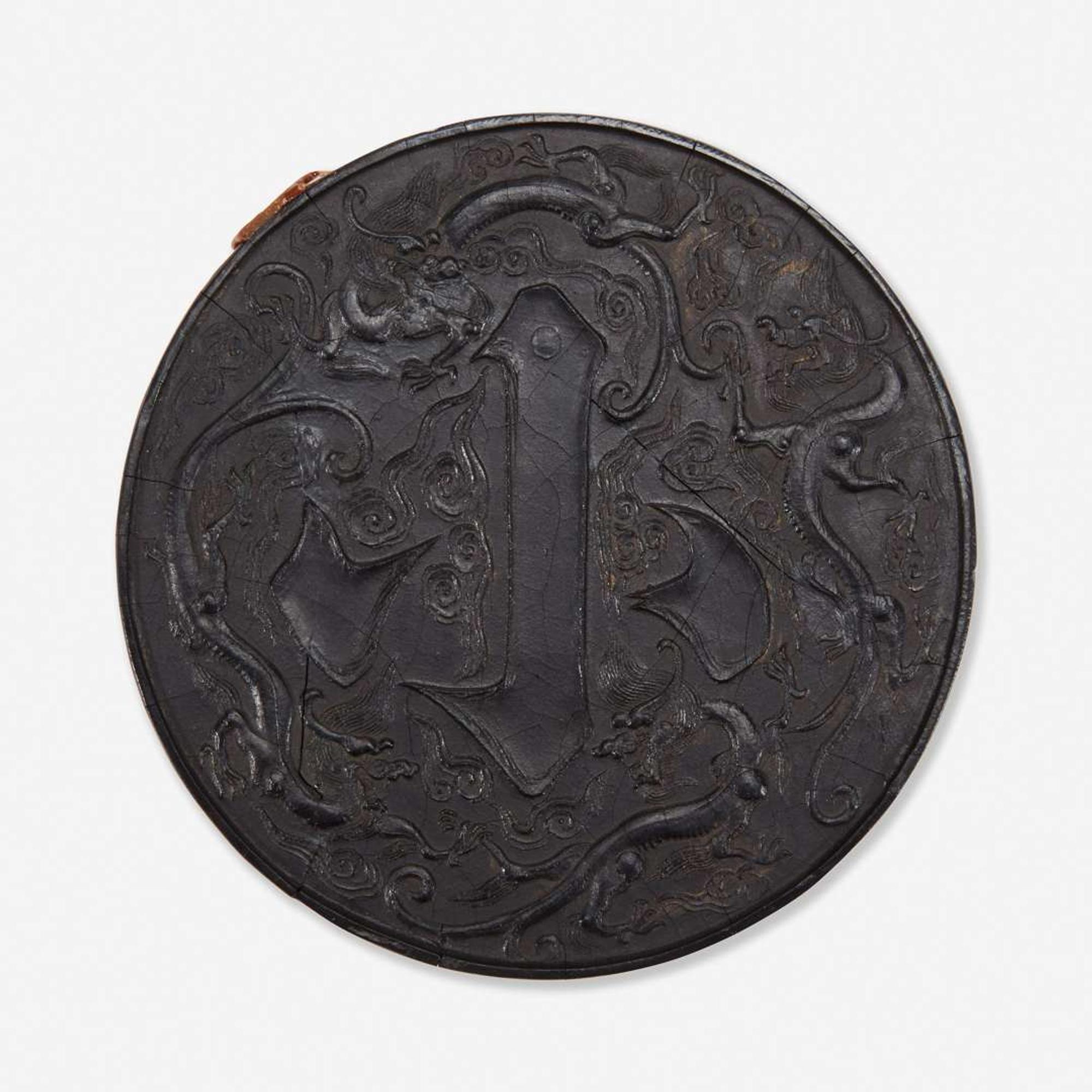 A Chinese circular ink cake 圆形墨饼