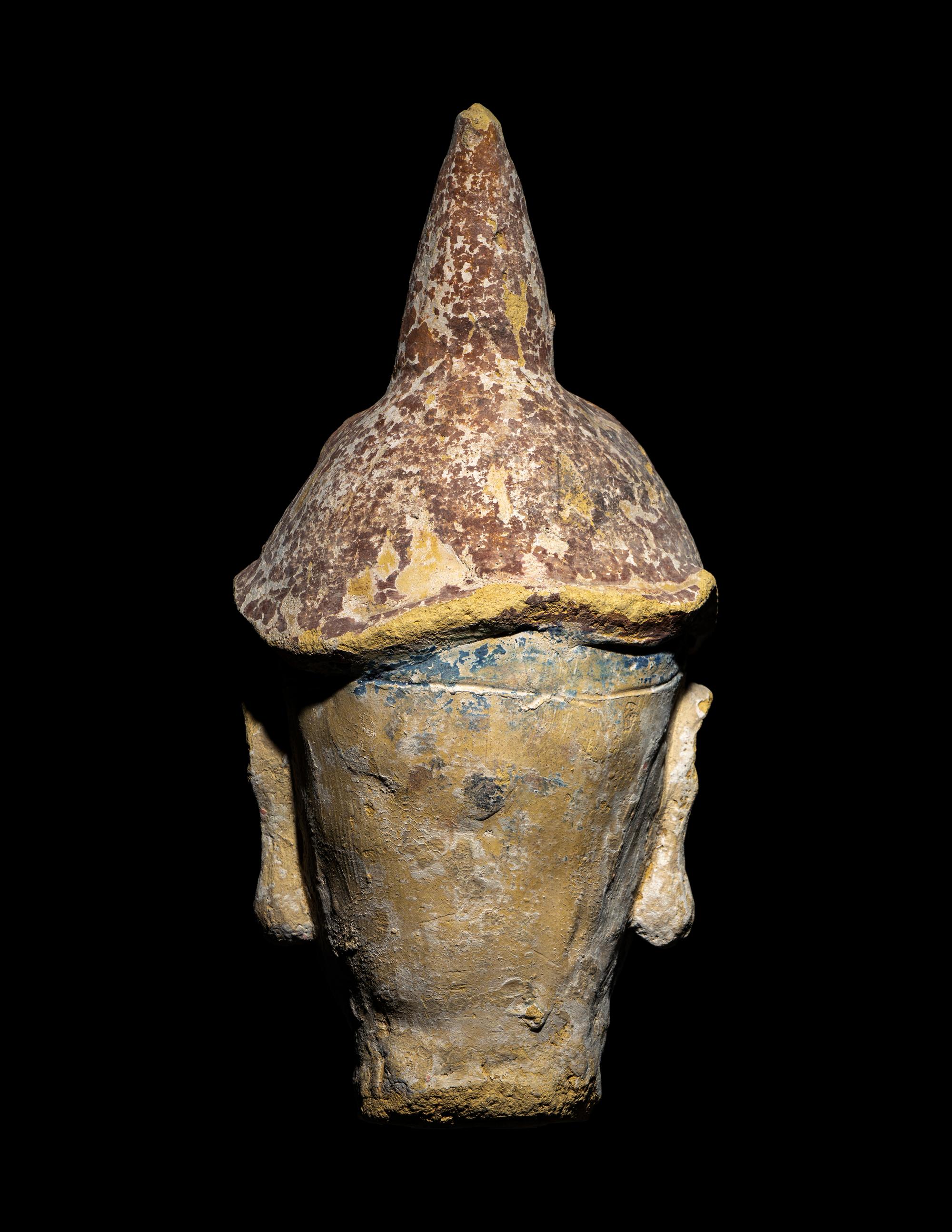 A Polychrome Stucco Head of a Temple Guardian