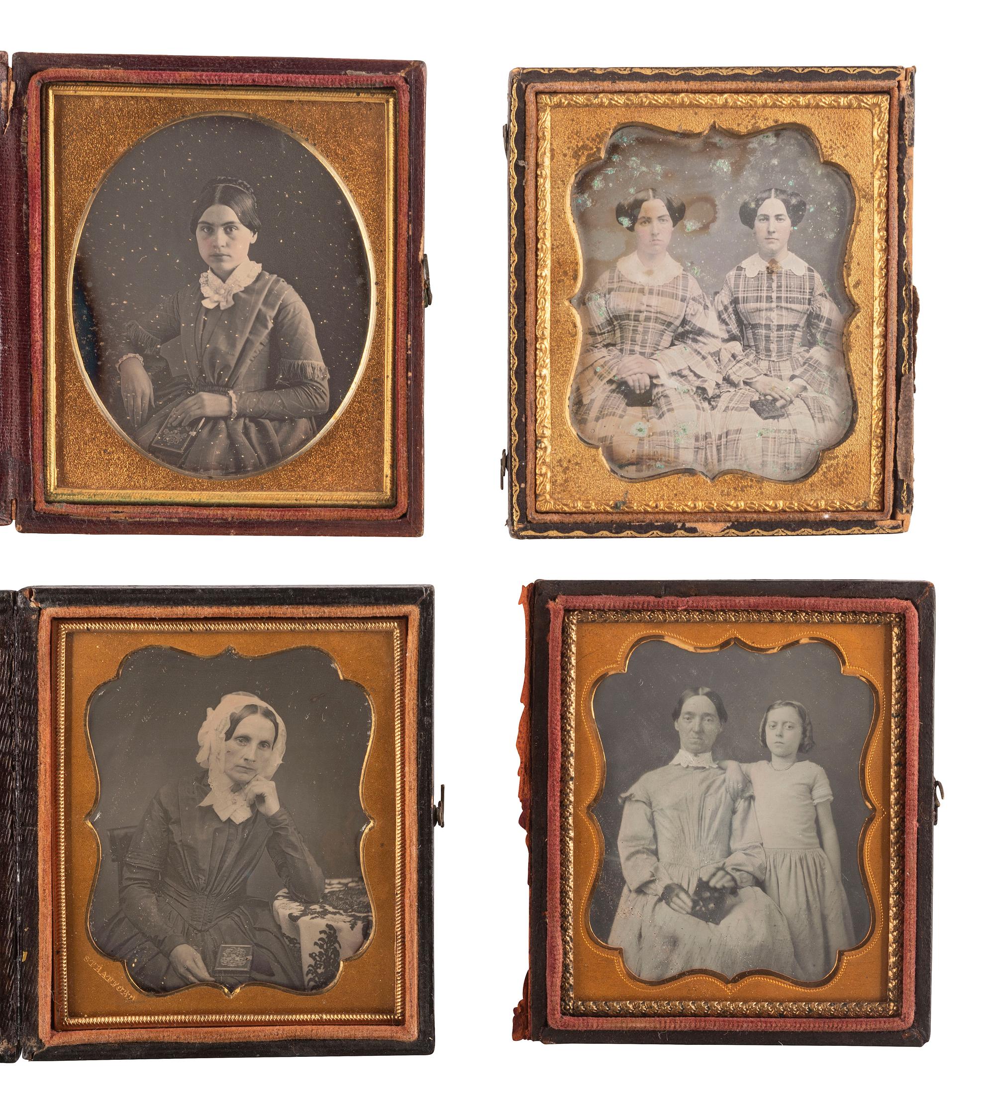 [EARLY PHOTOGRAPHY]. A group of 23 daguerreotypes featuring subjects posed with cased images, including: