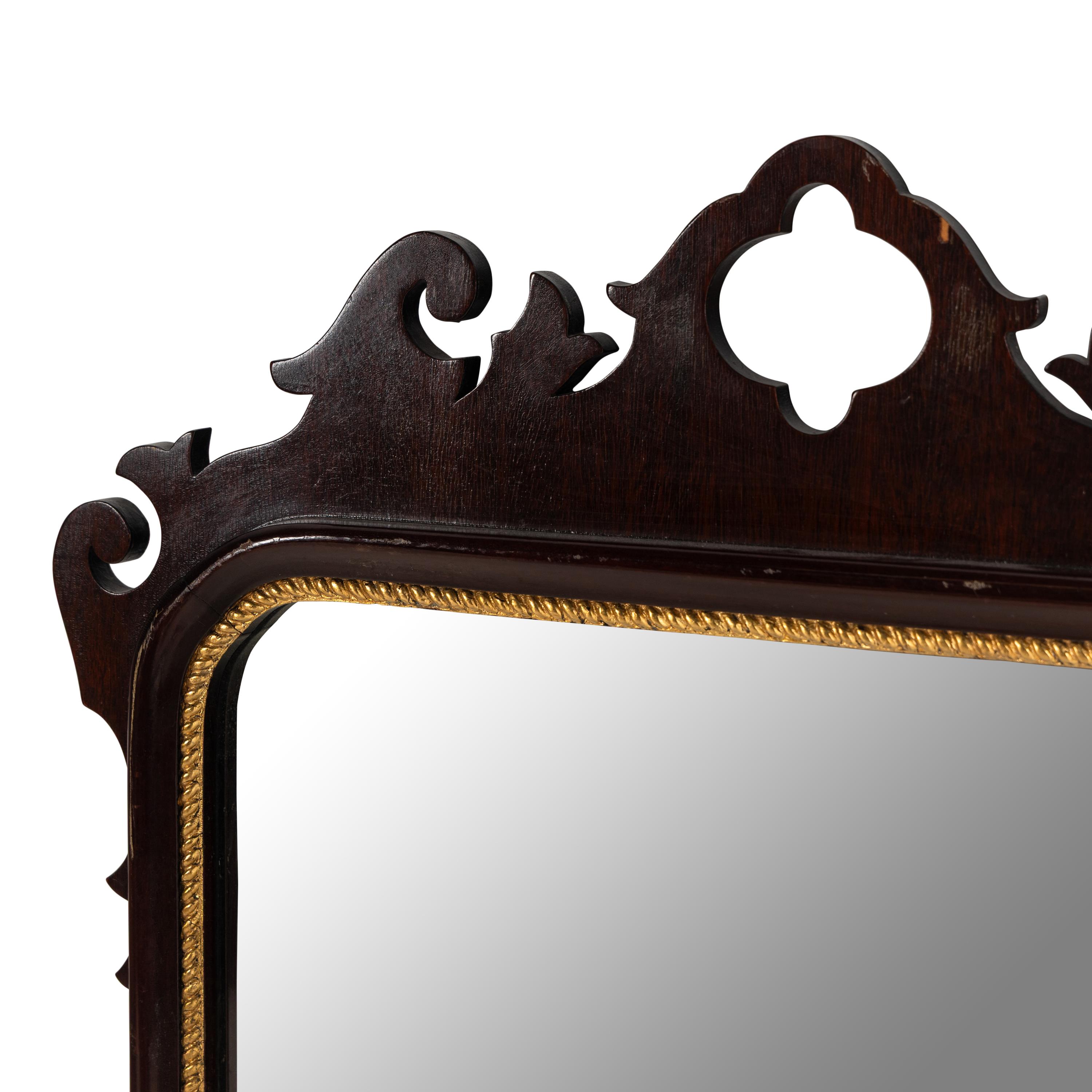 A George III Style Mahogany and Parcel Gilt Mirror