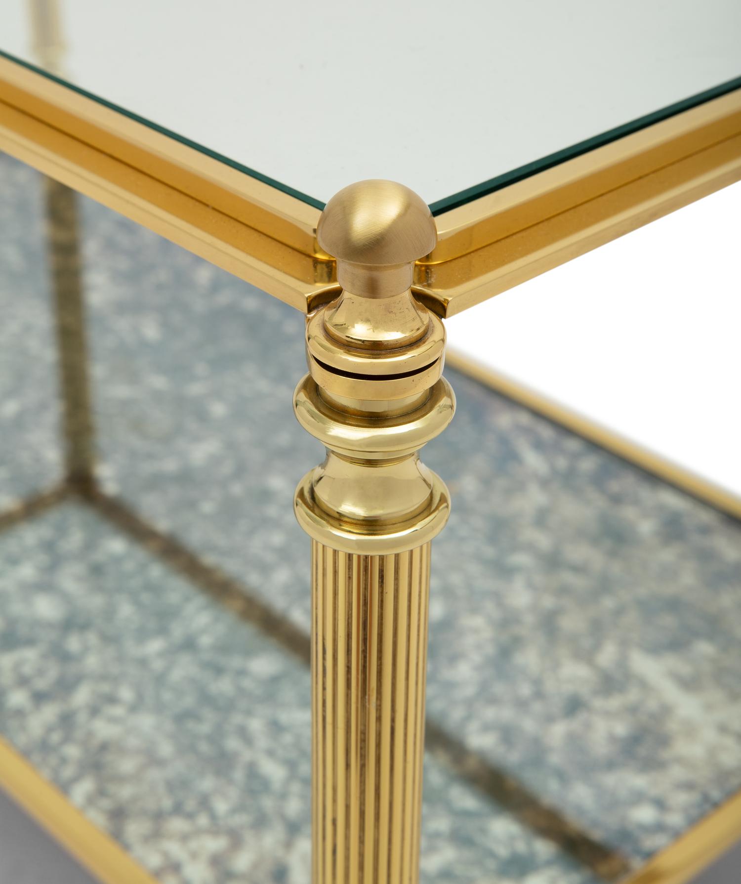 A Brass and Glass Cocktail Table