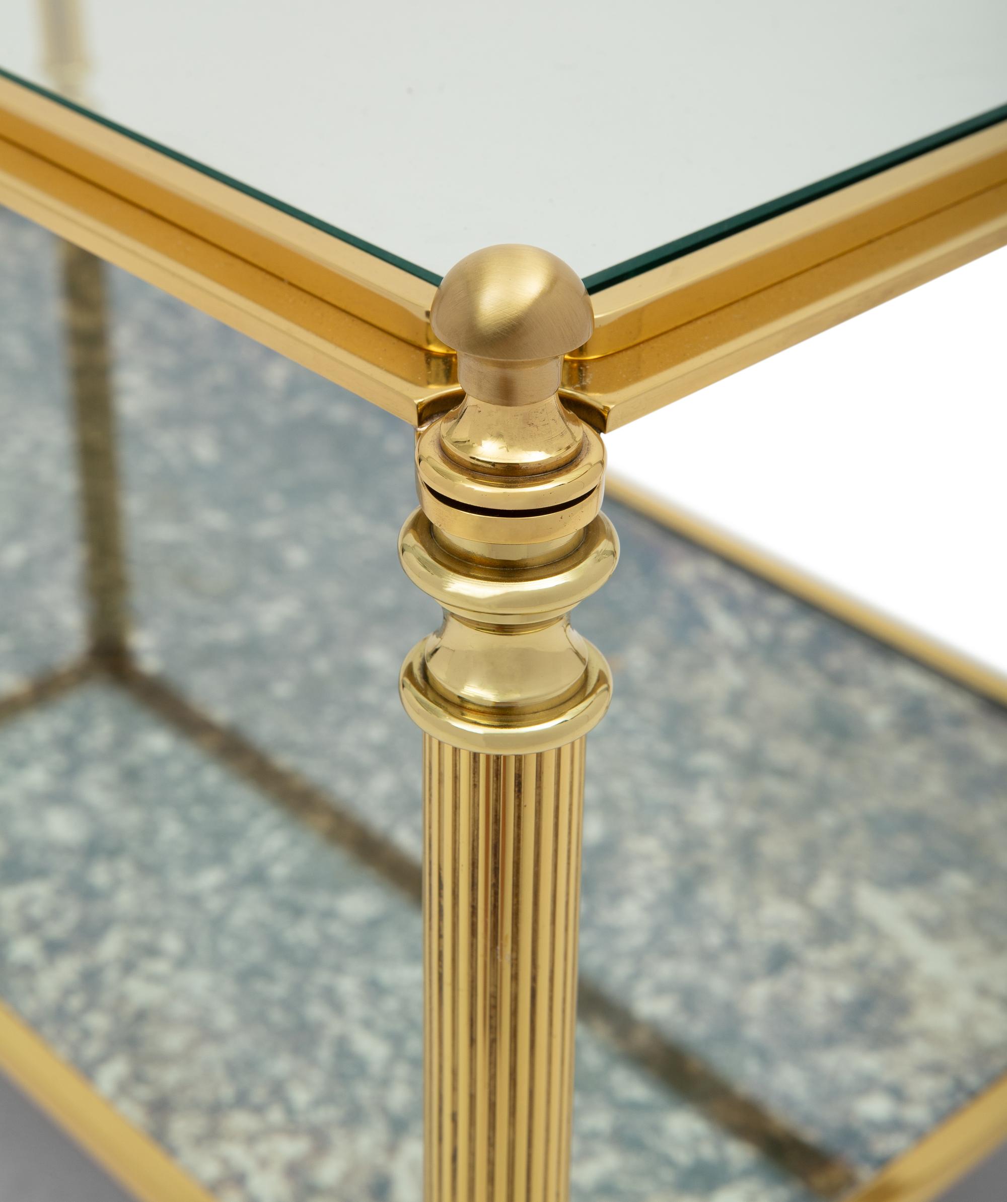 A Brass and Glass Cocktail Table