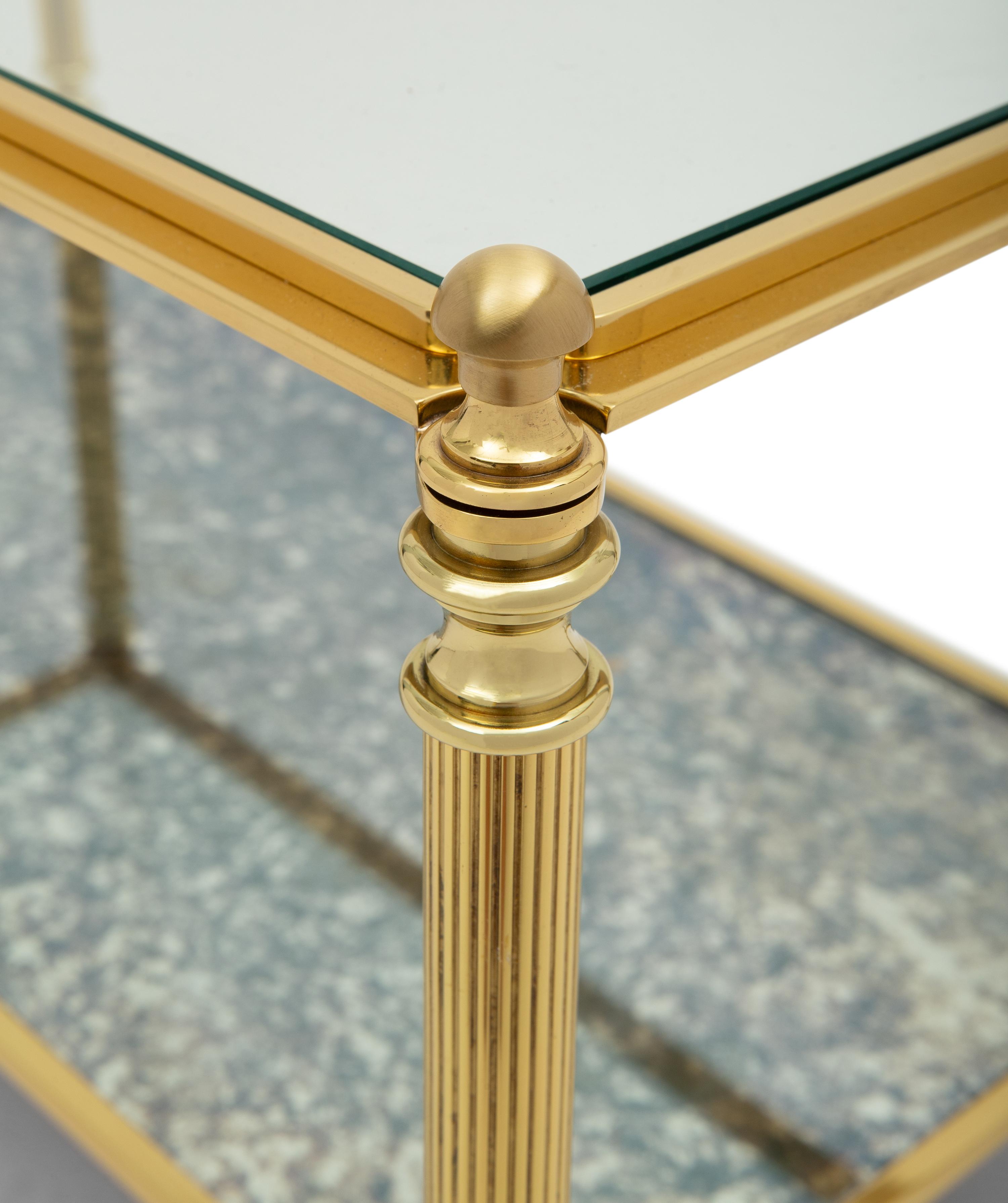 A Brass and Glass Cocktail Table