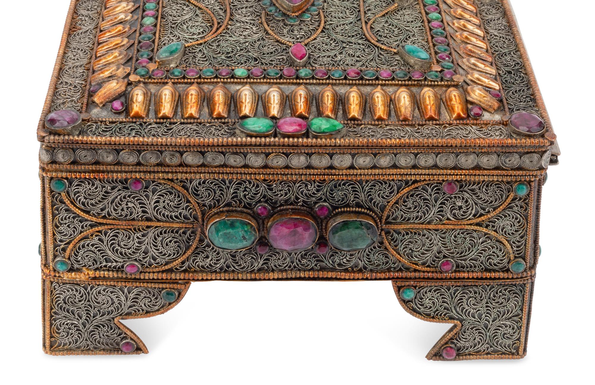 A Silvered Metal Filigree, Ruby and Emerald Table Casket