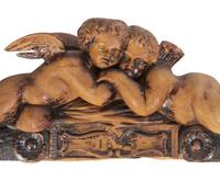A French Carved Walnut Figural Overdoor Panel