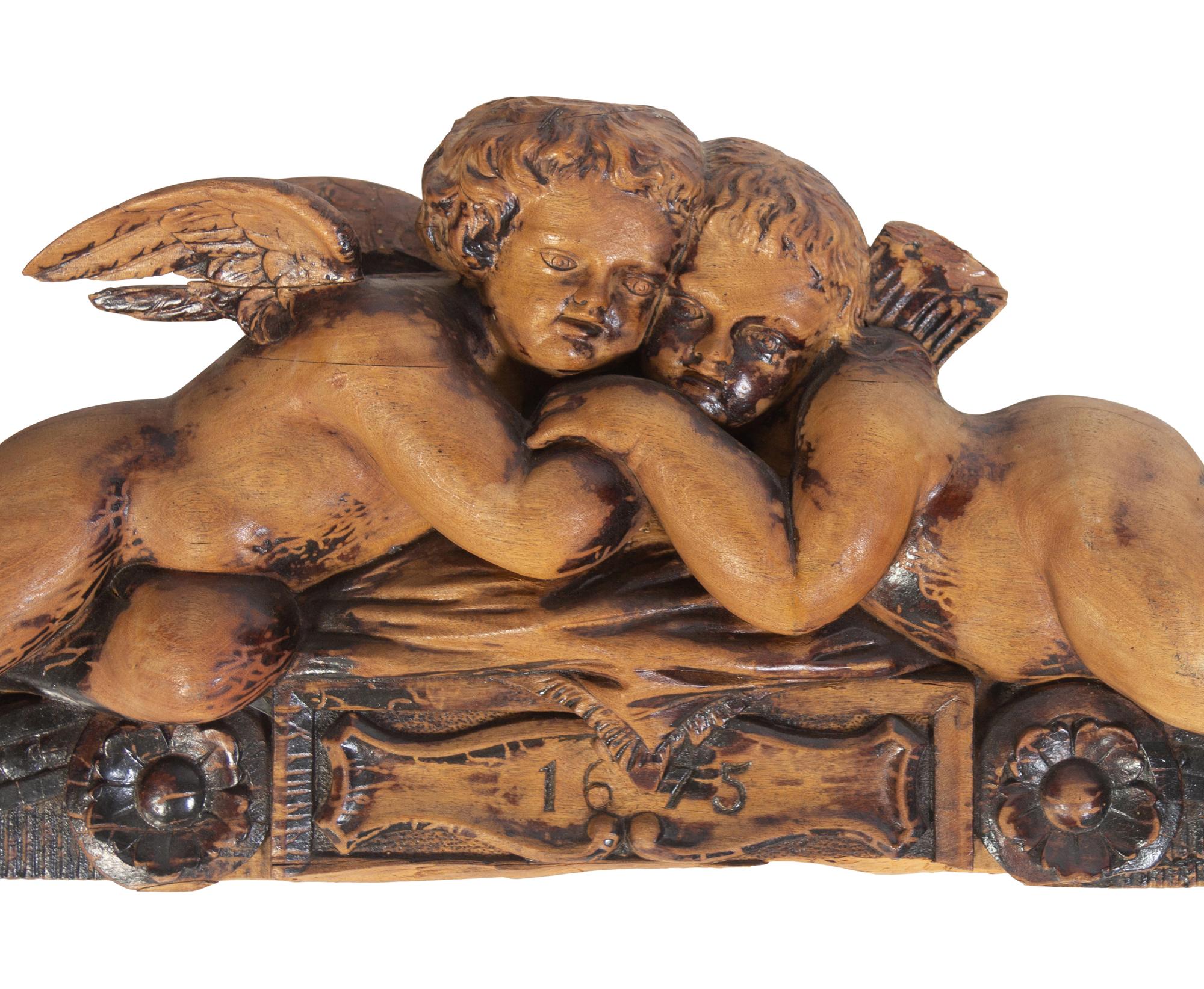 A French Carved Walnut Figural Overdoor Panel