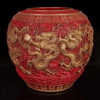 A massive Chinese faux cinnabar lacquer modeled porcelain "Dragons" jardinière 朱紅漆繪模印龍紋缸 Qianlong six character mark in relief to the neck ?????