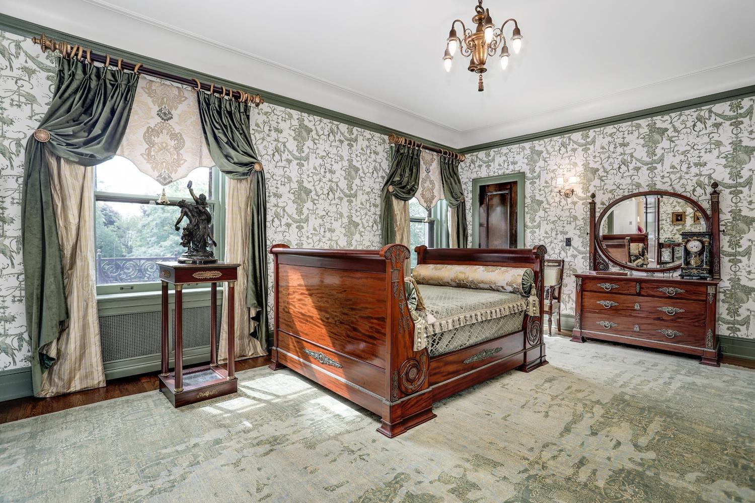 A Pair of Large Gilt Bronze Mounted Sèvres Style Porcelain Urns