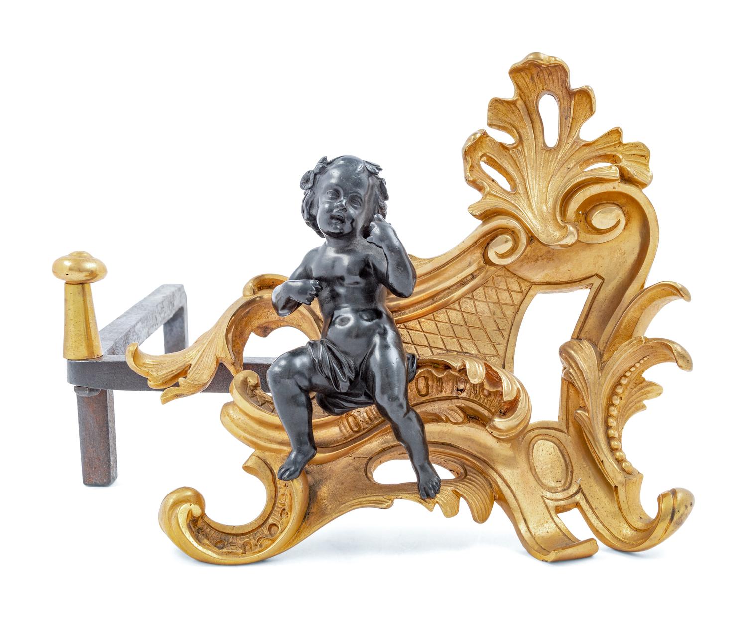 A Pair of French Gilt and Patinated Bronze Figural Chenets and Fender