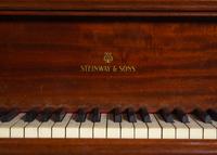 A Steinway and Sons Walnut Grand Piano and Bench