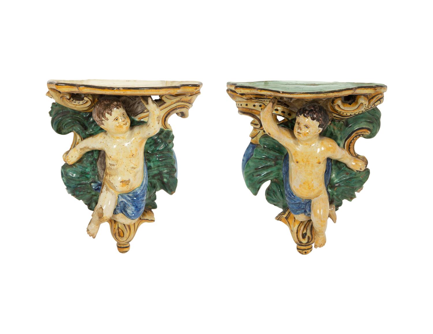 A Pair of Tin-Glazed Earthenware Wall Brackets, and Two Giltwood Wall Brackets