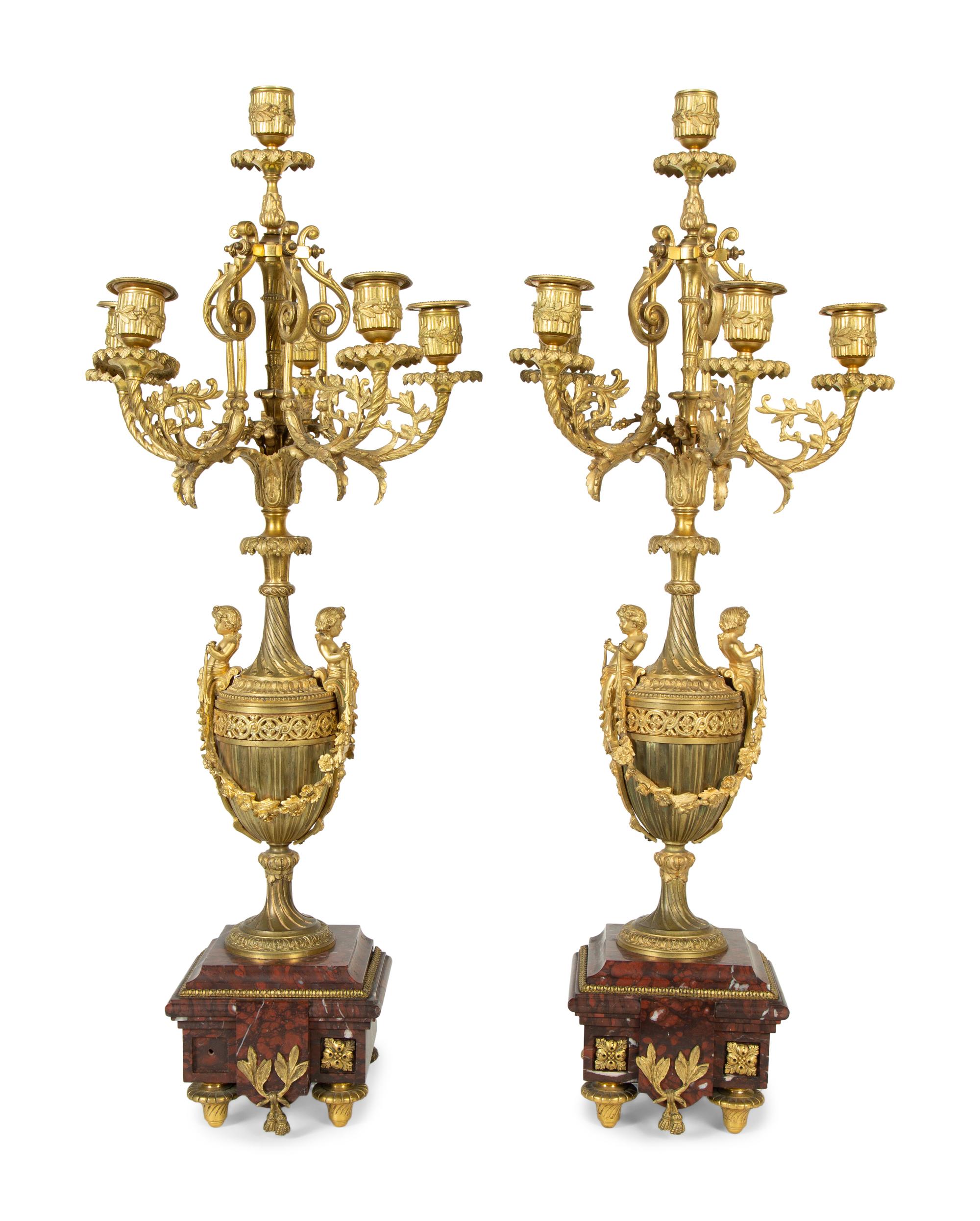 A Pair of French Gilt Bronze and Marble Urn-Form Six-Light Candelabra