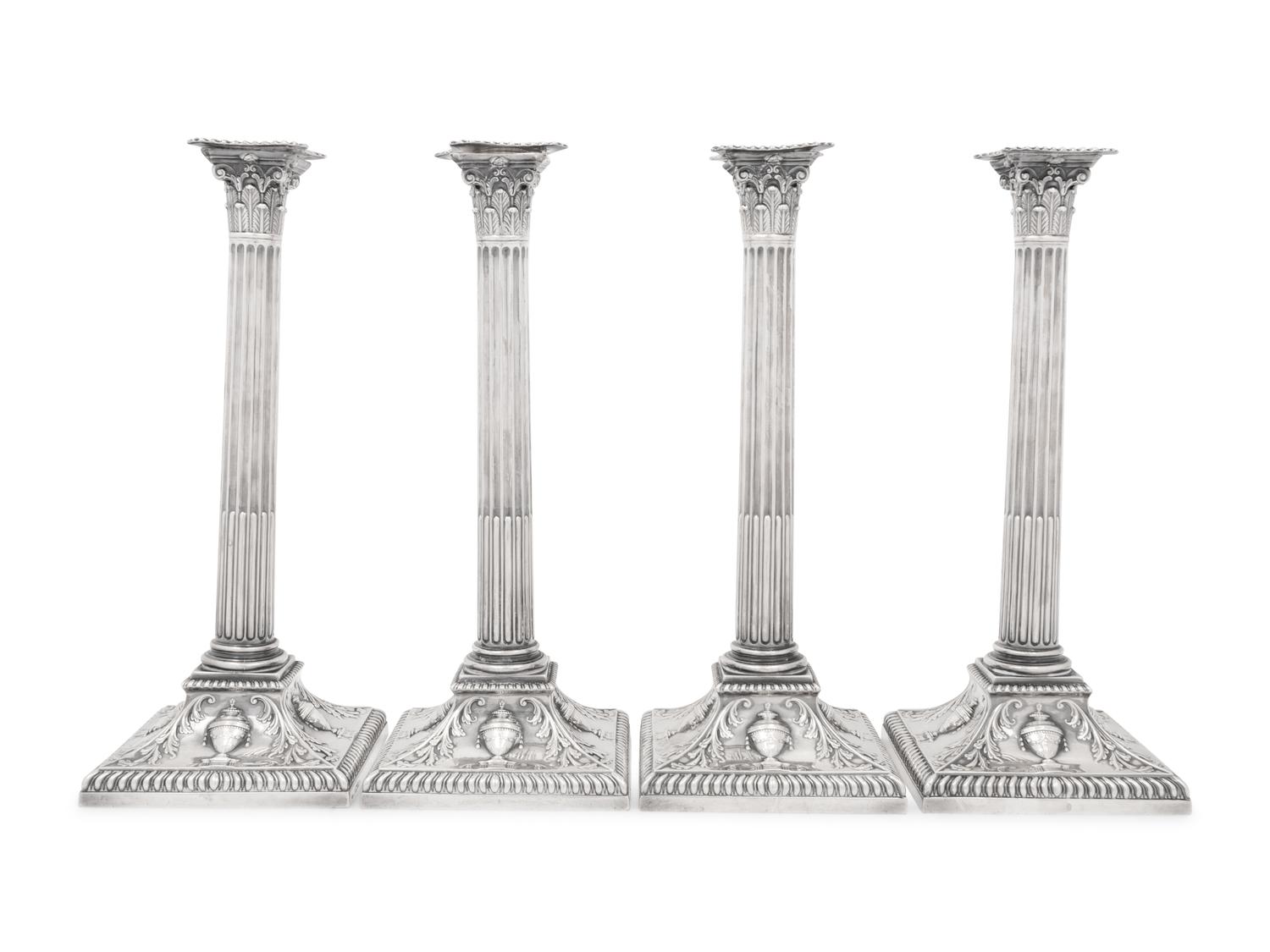An Assembled Set of Four Victorian and Edwardian Silver Candlesticks