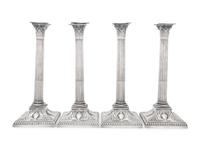 An Assembled Set of Four Victorian and Edwardian Silver Candlesticks
