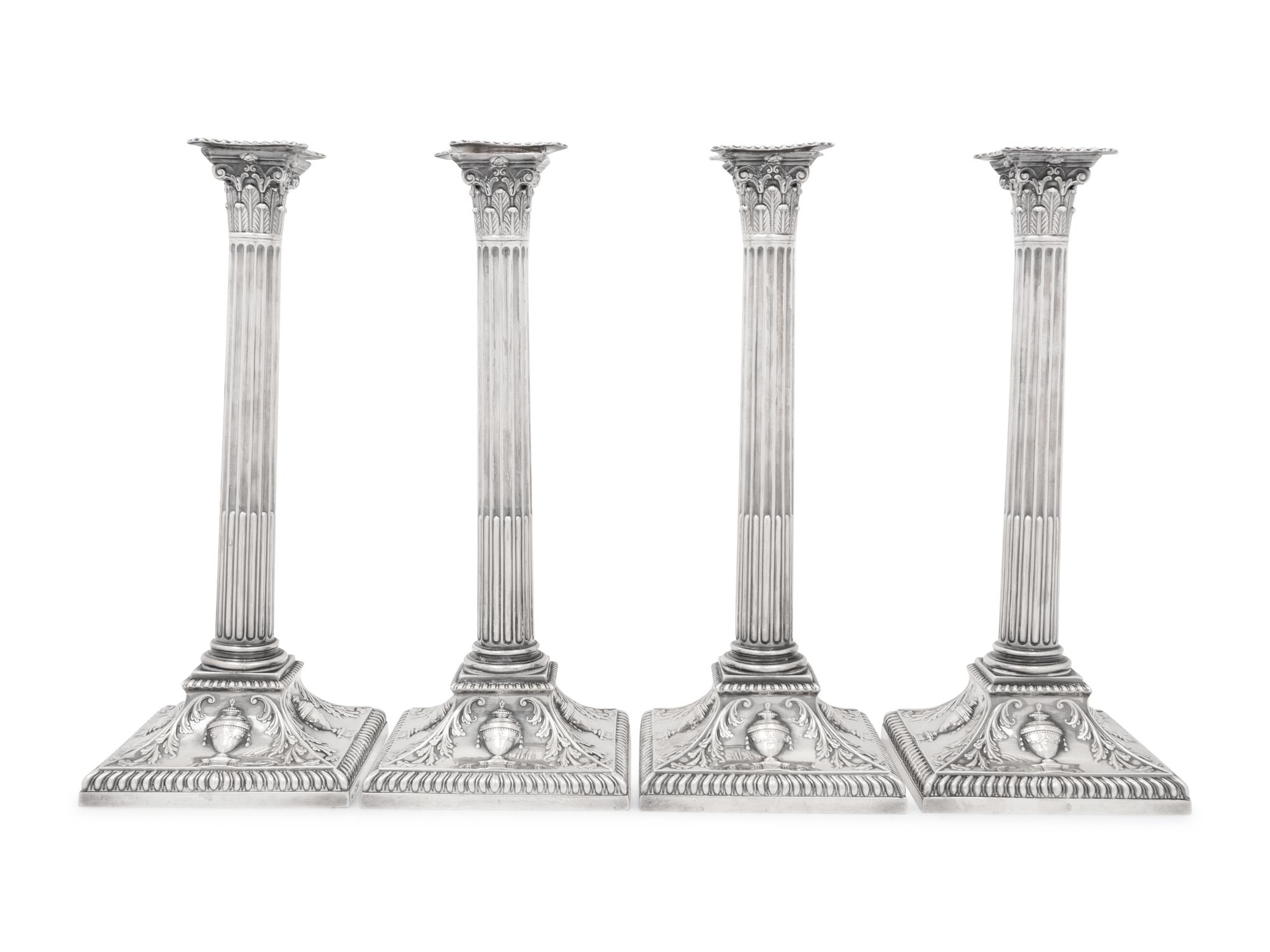 An Assembled Set of Four Victorian and Edwardian Silver Candlesticks