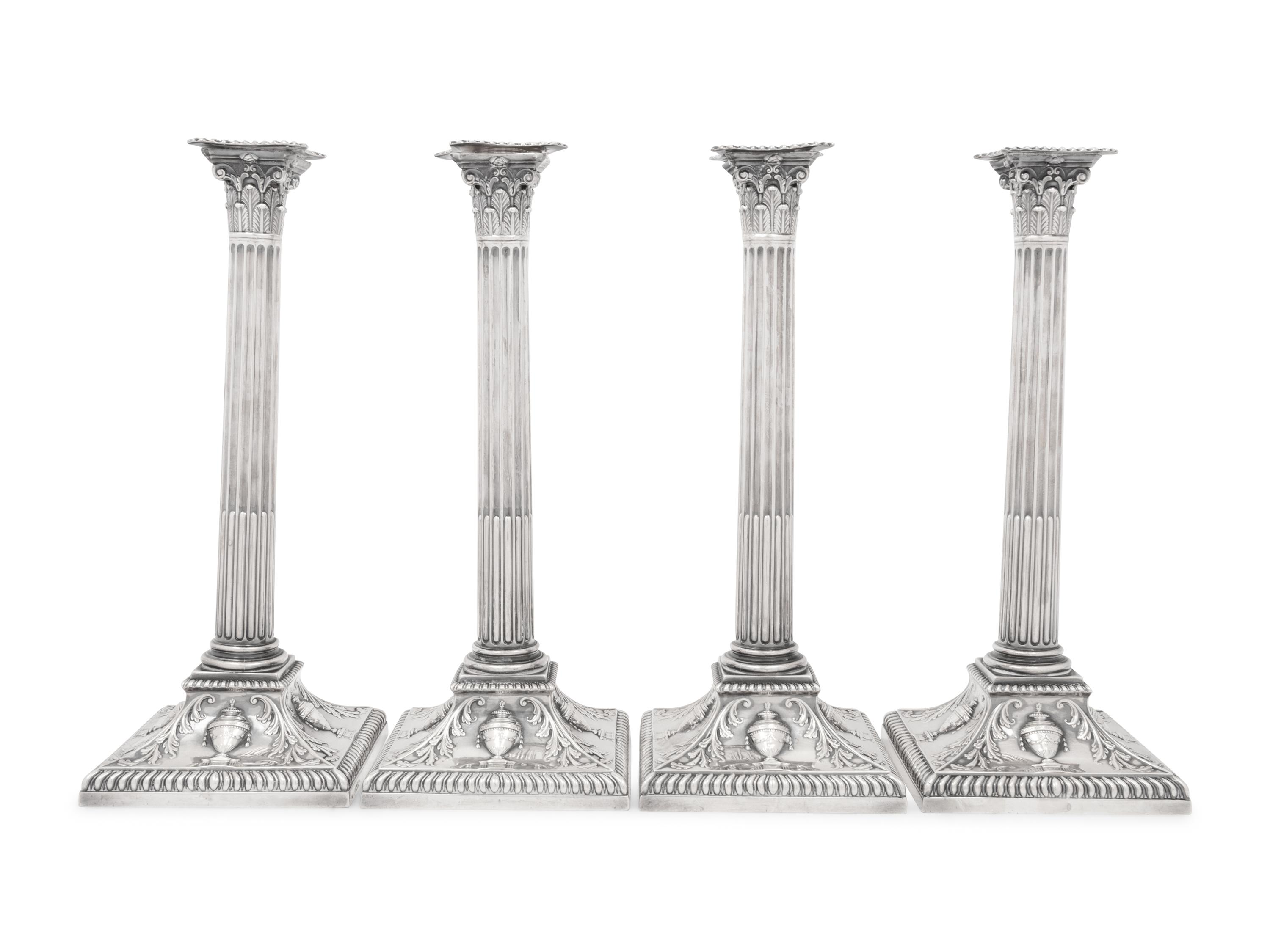 An Assembled Set of Four Victorian and Edwardian Silver Candlesticks