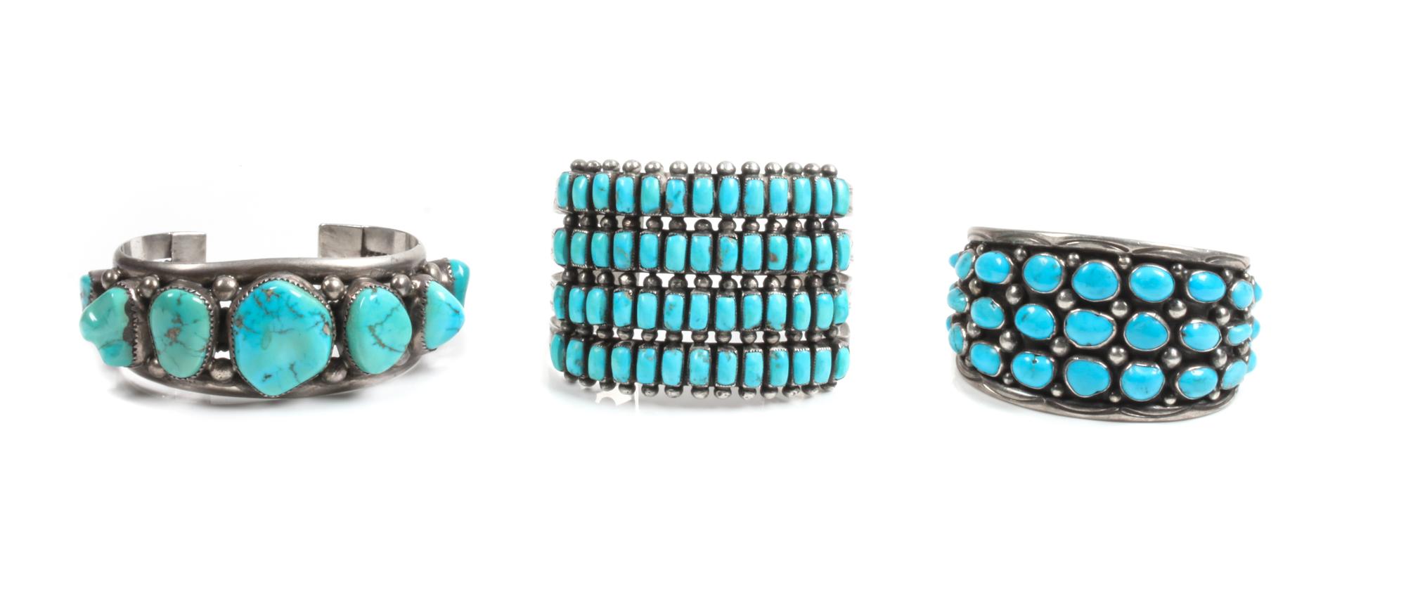 Three Southwestern Silver and Turquoise Cuff Bracelets Length of first 5 3/4 x opening 1 1/8 x width 1 7/8 inches