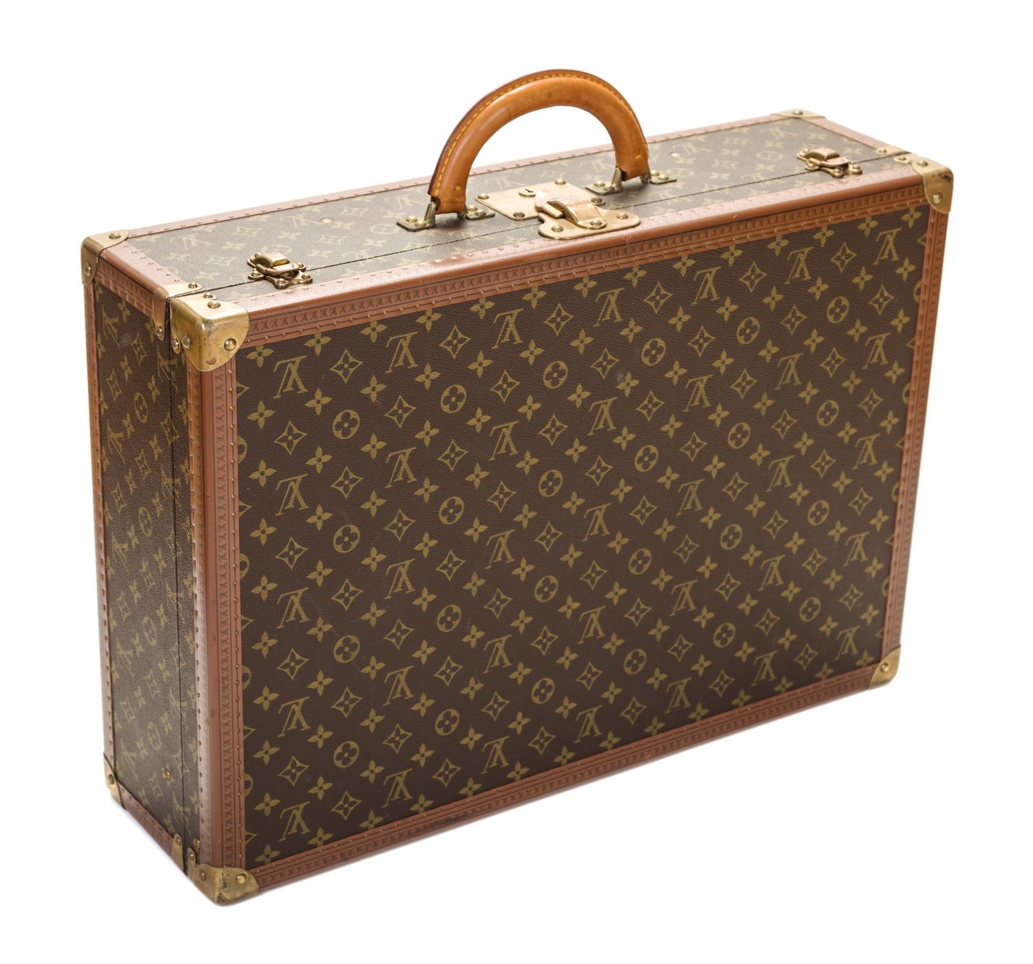 A Louis Vuitton Monogram Canvas Bisten 60 Suitcase, 23.6" x 16.5" x 7.1".