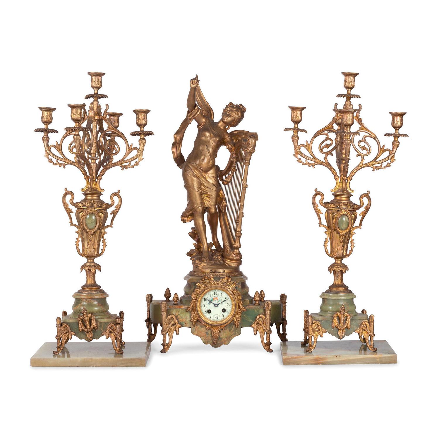 A Neoclassical Gilt Metal and Onyx Clock Garniture