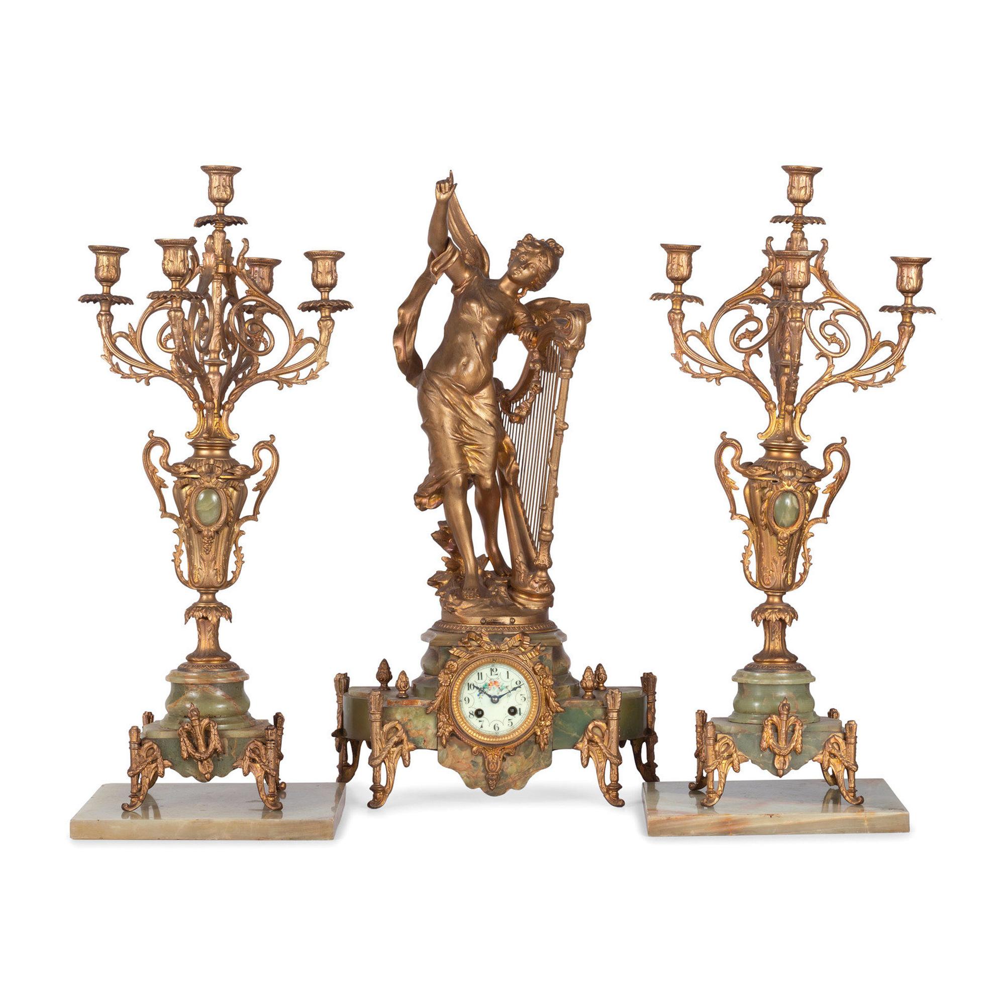 A Neoclassical Gilt Metal and Onyx Clock Garniture