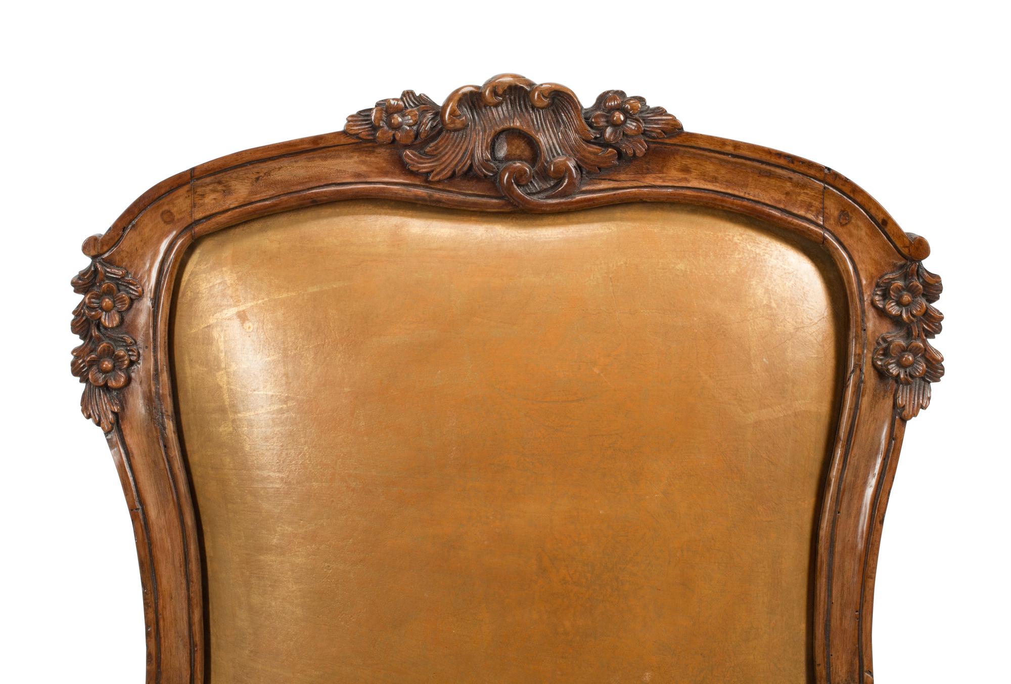 A Pair of French Provincial Carved Walnut Armchairs