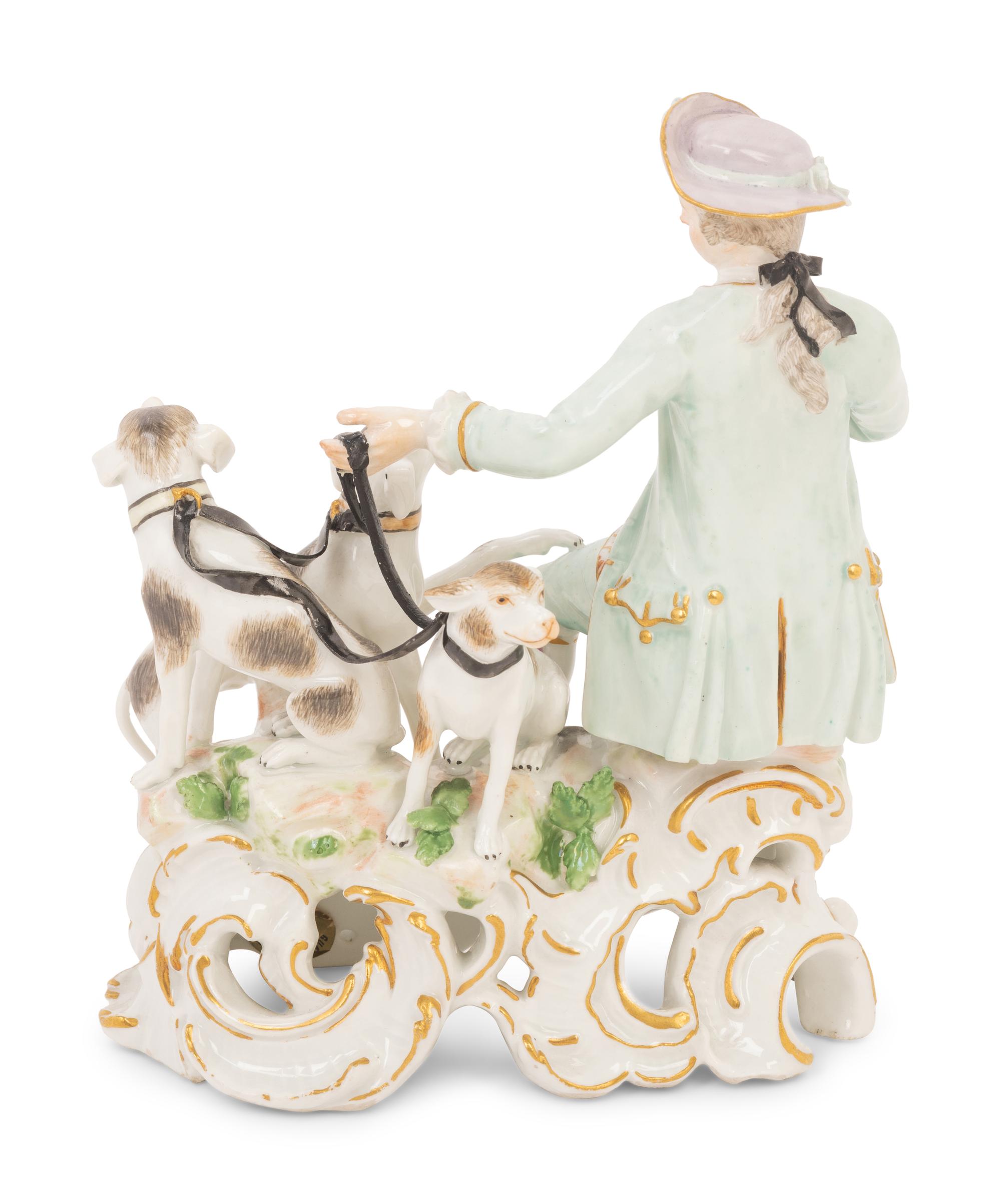 A Meissen Porcelain Figural Group of a Man with Hounds