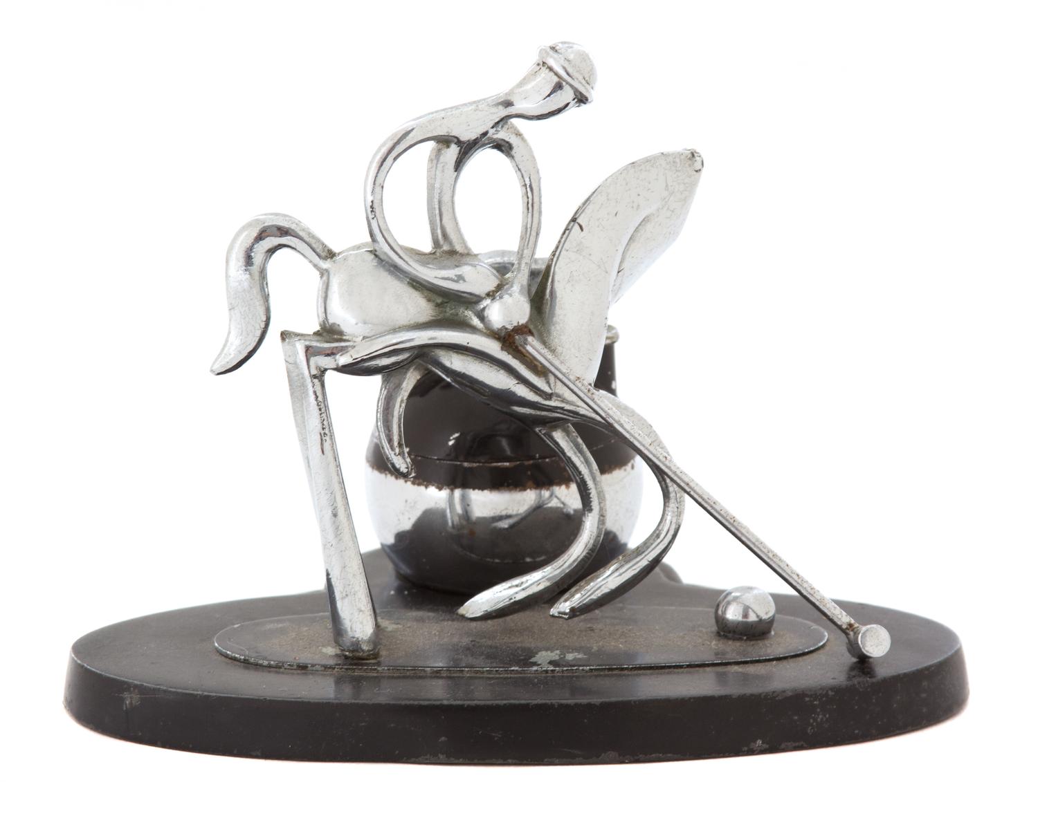 A Chromed Metal Polo Player-Form Ronson Cigarette Lighter Stand Height 4 1/2 x width 5 1/8 x depth 4 inches. — 20TH CENTURY