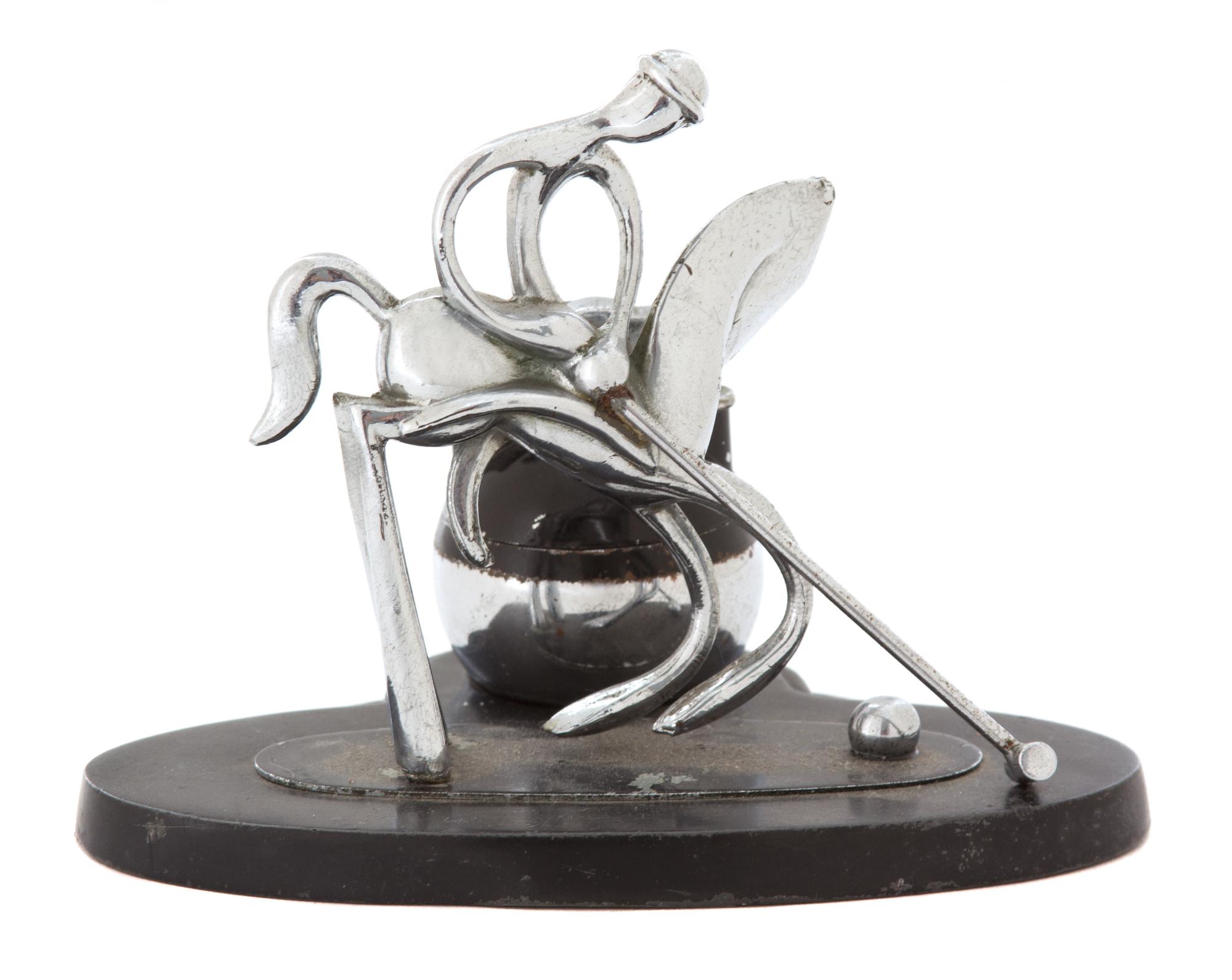 A Chromed Metal Polo Player-Form Ronson Cigarette Lighter Stand Height 4 1/2 x width 5 1/8 x depth 4 inches. — 20TH CENTURY