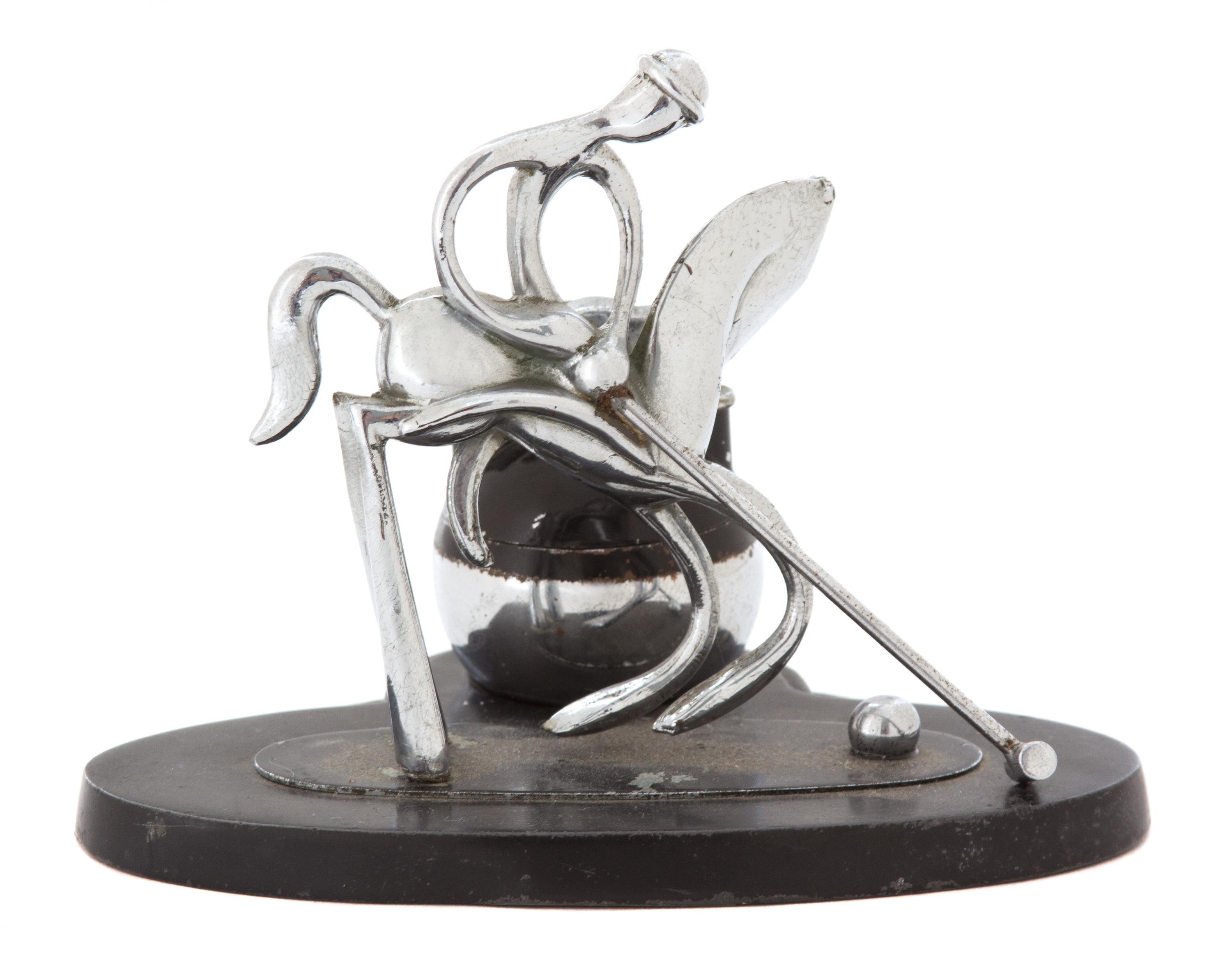 A Chromed Metal Polo Player-Form Ronson Cigarette Lighter Stand Height 4 1/2 x width 5 1/8 x depth 4 inches. — 20TH CENTURY
