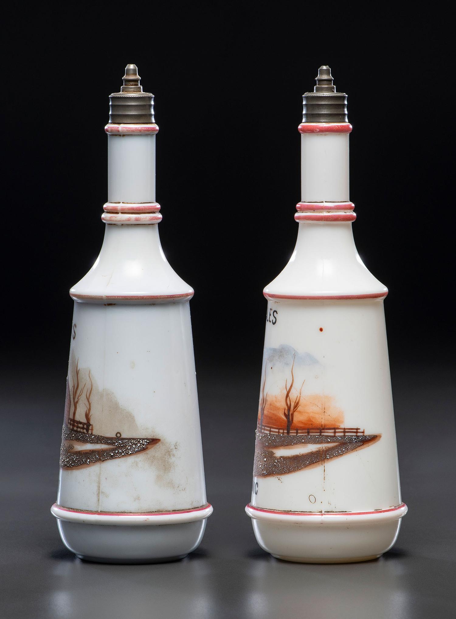 A Pair of Hand Painted Personalized Milk Glass Barber's Bottles
