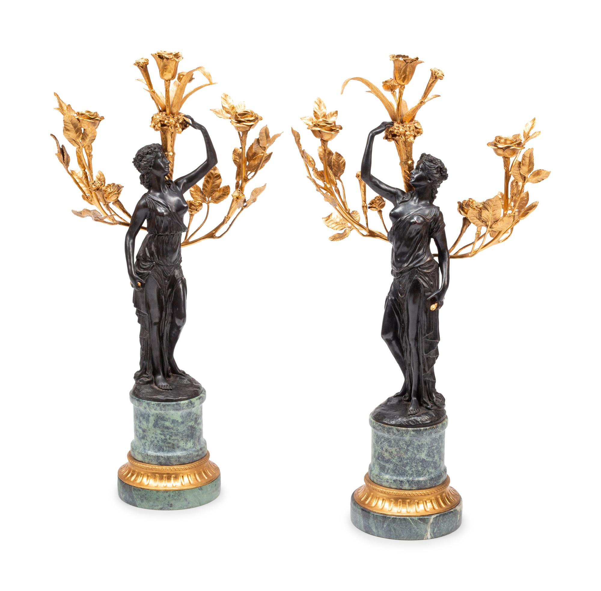 A Pair of French Gilt and Patinated Bronze and Marble Figural Three-Light Candelabra