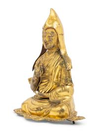A Tibetan Gilt Bronze Repoussé Seated Figure of Tsongkhapa
