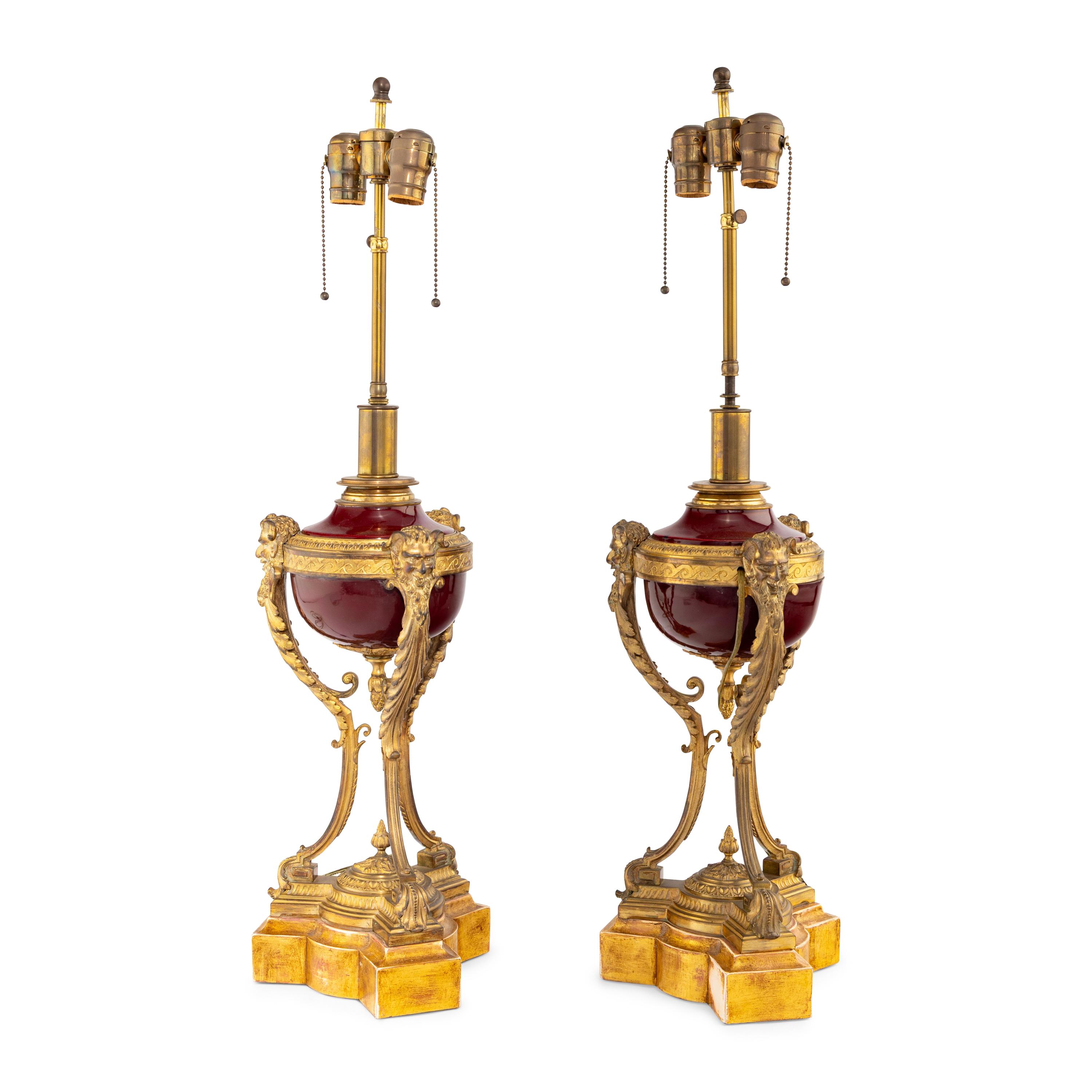 A Pair of Louis XVI Style Gilt Bronze Mounted Porcelain Urns